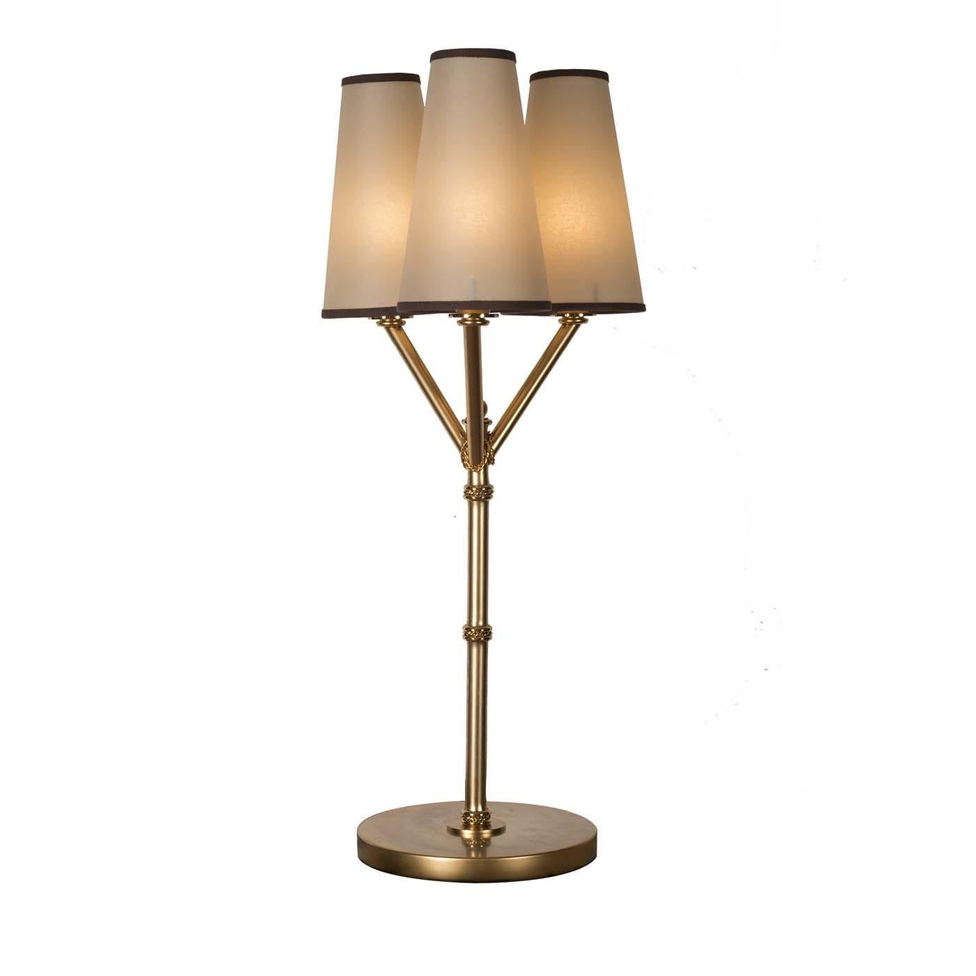 A piece of great visual effect, this striking table lamp is a superb statement piece for a modern and Classic living room or private study. Handcrafted of brass with a satin gold finish, the sleek silhouette boasts a tall, slender stem that branches
