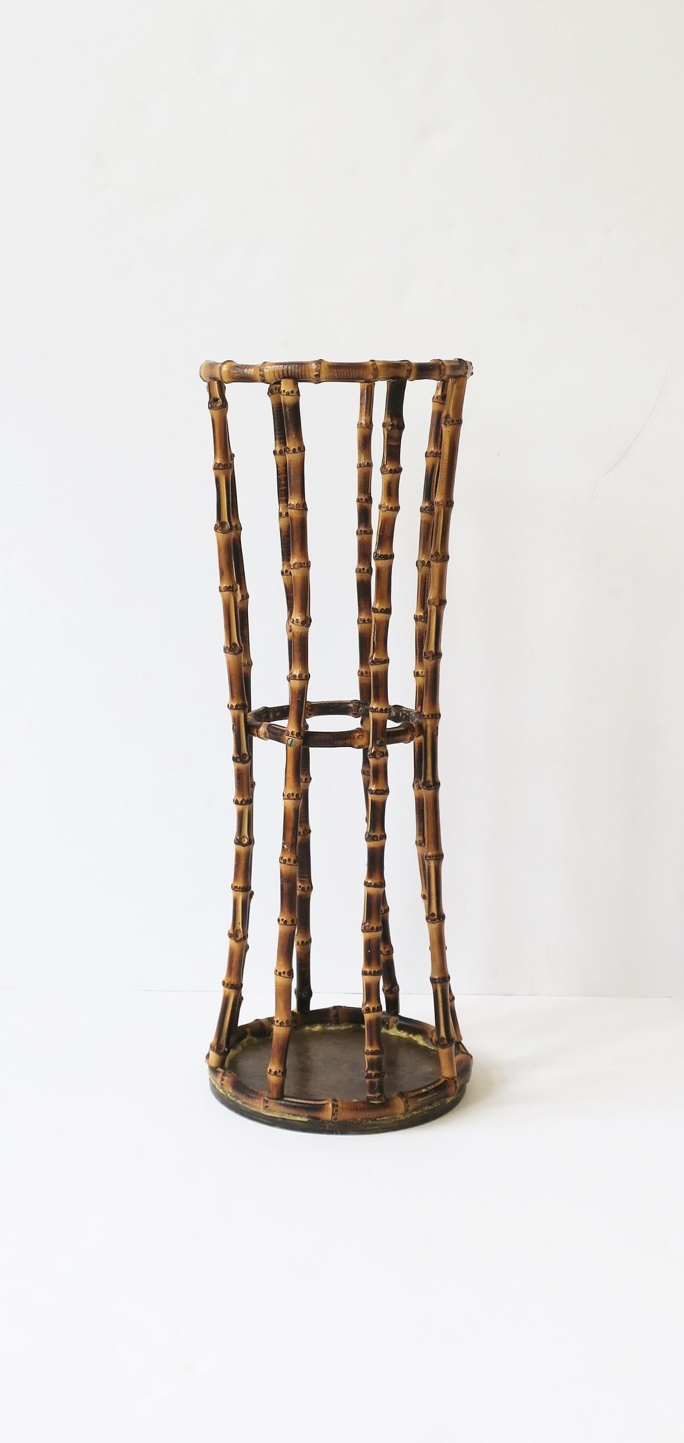 A bamboo umbrella holder stand with hourglass design in the style of Gucci, circa late-20th century. A great piece for home, office, etc. Dimensions: 9