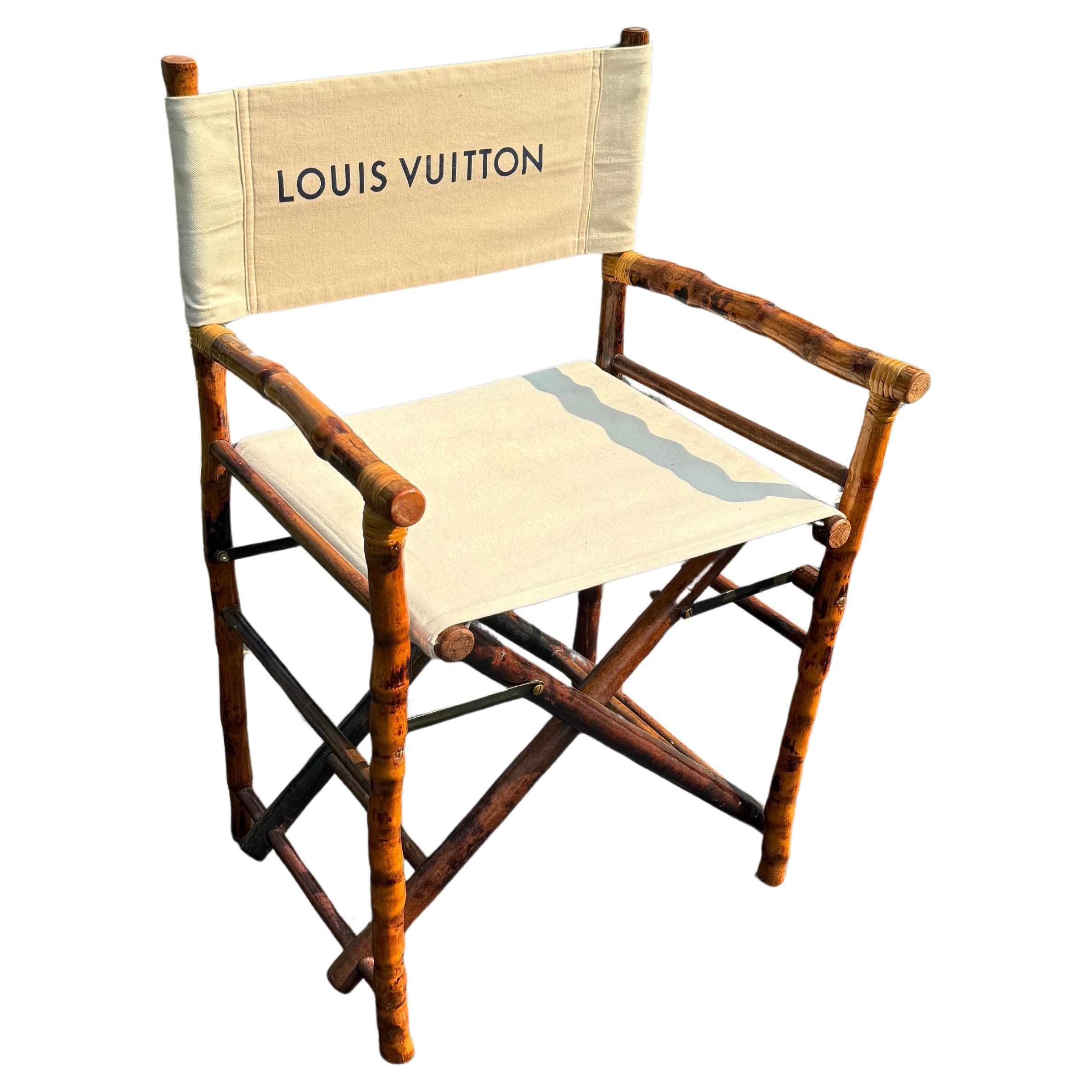 Design and purpose best describe this one-of-a-kind custom side chair. This piece features authentic Louis Vuitton printed fabric on a sturdy vintage bamboo chair. This seating was well thought out and then executed by a professional upholster.