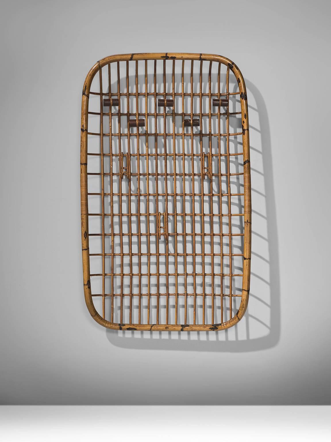 Olaf von Bohr for Vittorio Bonacina, bamboo coat rack, 1960s, Italy. 

Rack with bent bamboo which creates a structure and has three adjustable hooks which can be placed anywhere on the grill. On the top part of the rack there are five nobes which
