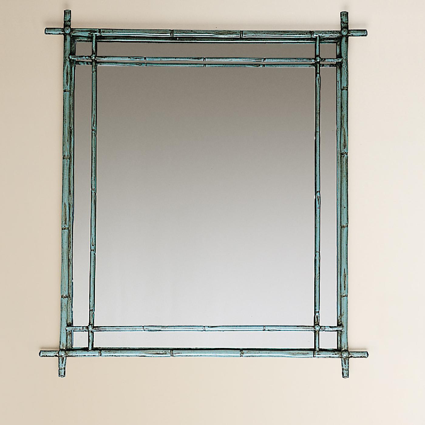 Timeless and elegant, this mirror will look stunning in any interior. A double decorative element divides the rectangular reflective surface while enclosing it in a delicate frame crafted of forged iron in the shape of slender bamboo sticks. Used to