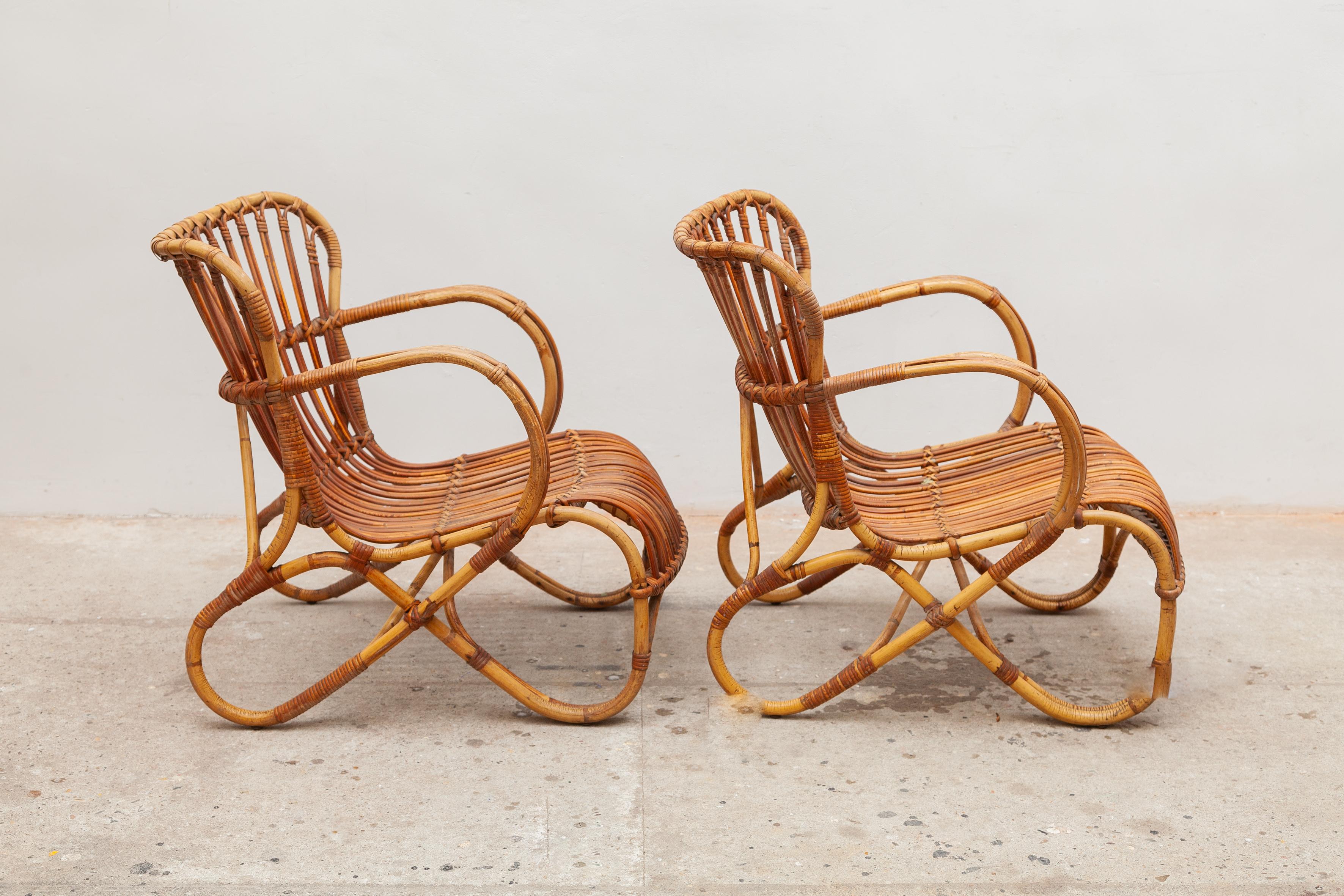 Vintage midcentury bamboo wicker lounge chairs. Sculptural looping frame with woven seats.
Dimensions: 56 W x 70 H x 68 D cm, seat: 34cm high. Original very good condition.