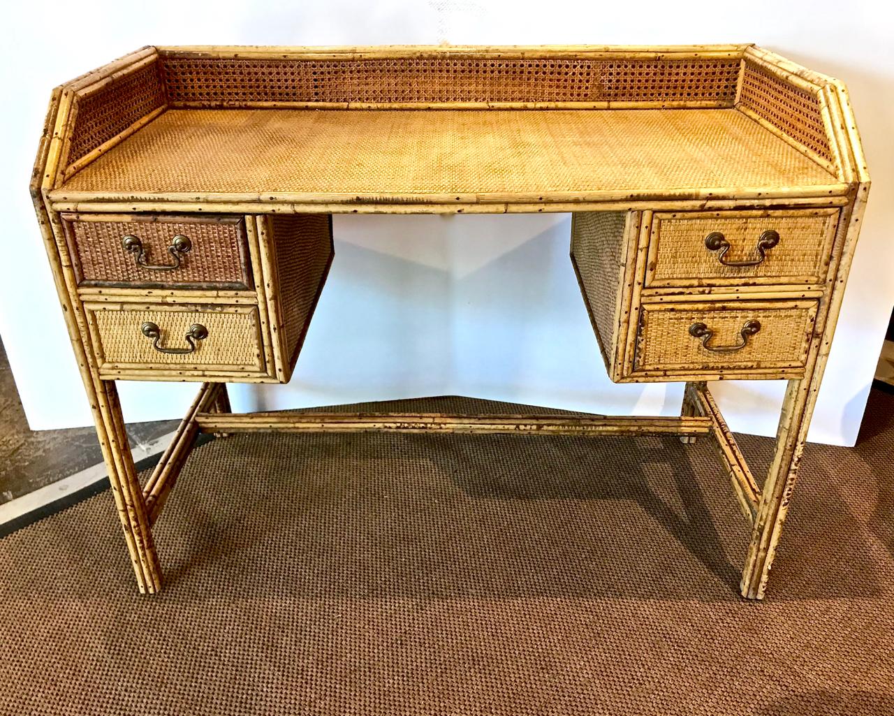 This is a wonderful circa 1930s bamboo, rattan and cane writing desk or dressing table in original condition. The photos speak to the highly decorative, but practical, design of the desk. Perfect East Coast cottage style.