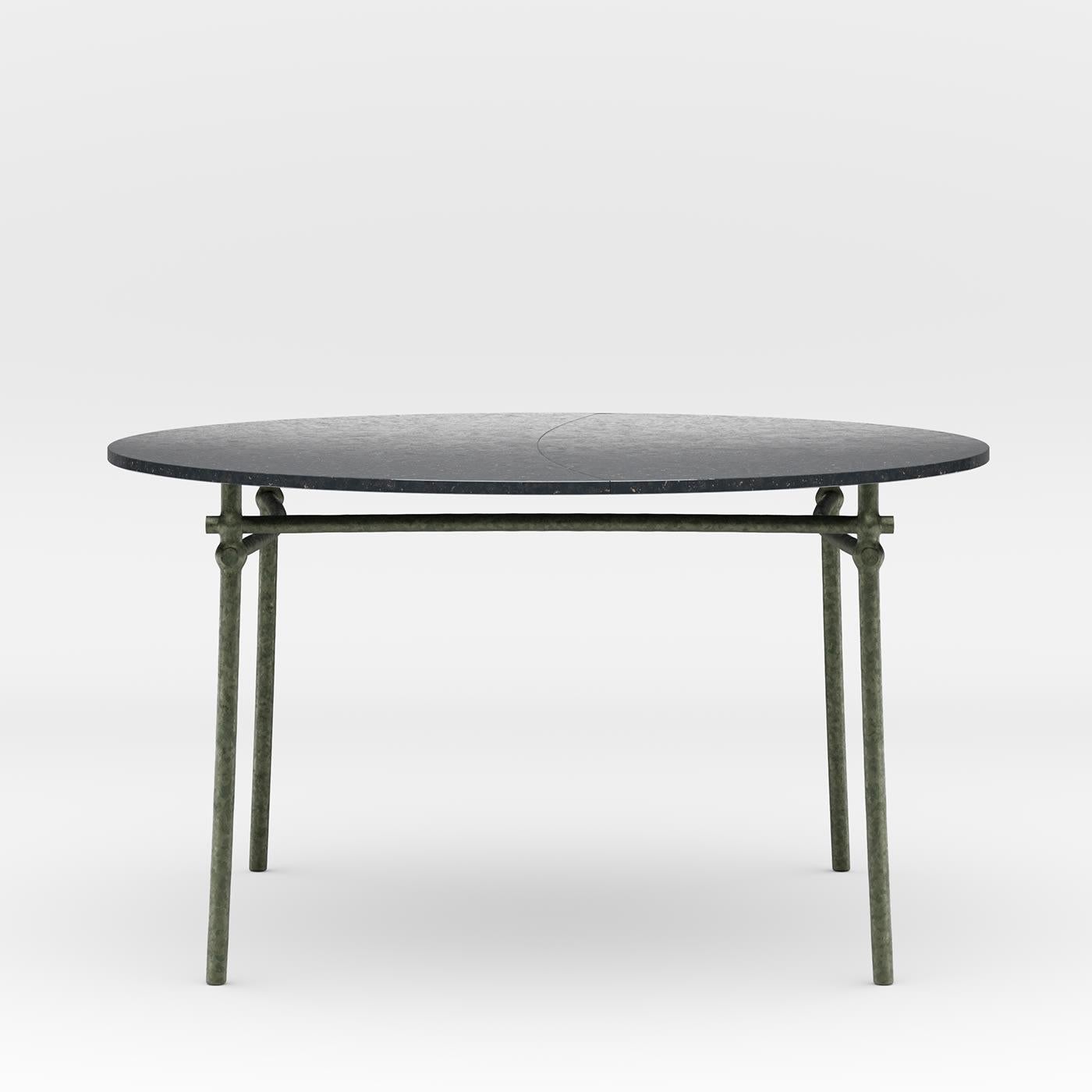 An industrial-chic design of timeless sophistication, this round dining table will make for a stately accent to a contemporary setting, ideally combined with the gazebo and other furniture by Dante Negro. Designed in collaboration with