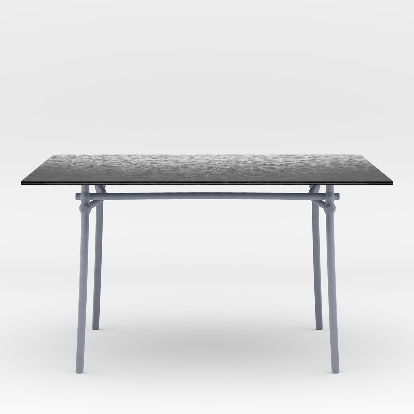 Imbued with timeless sophistication, this square dining table will exude an elegant, industrial-chic flair. Designed in collaboration with Zanellato/Bortotto, it is handcrafted of lacquered and zinc-coated metal, with a top in natural lava stone.