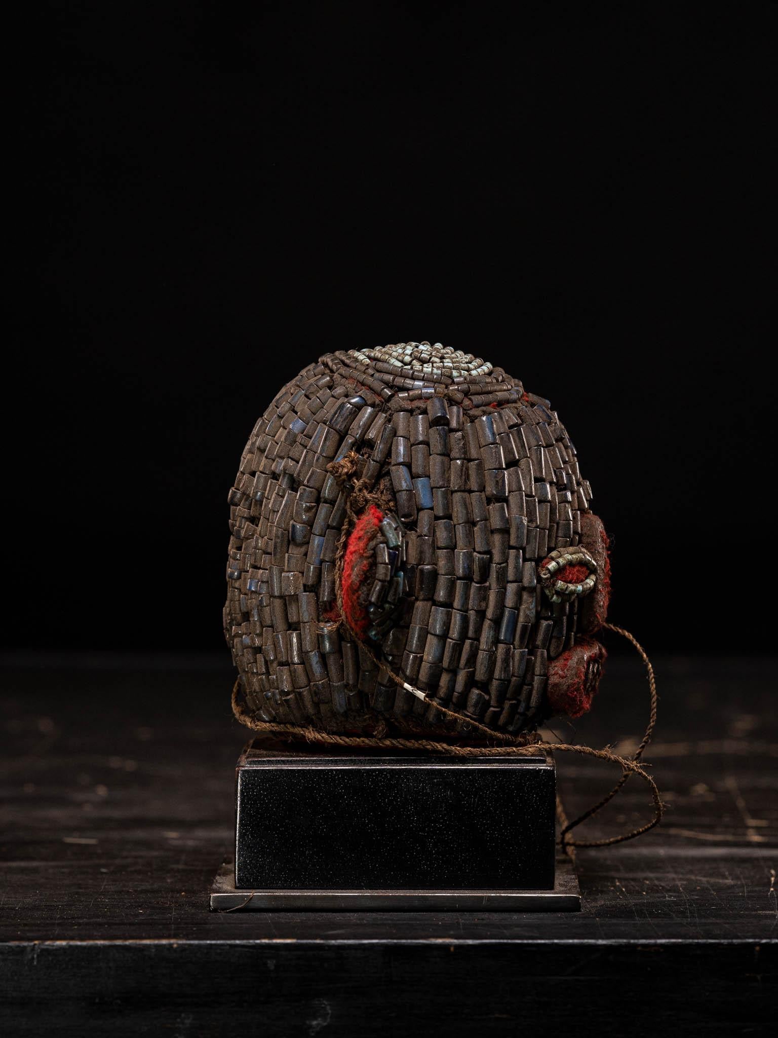 20th Century Bamileke Old Anthropomorphic Trophy Head Embroidered with European Glass Beads For Sale