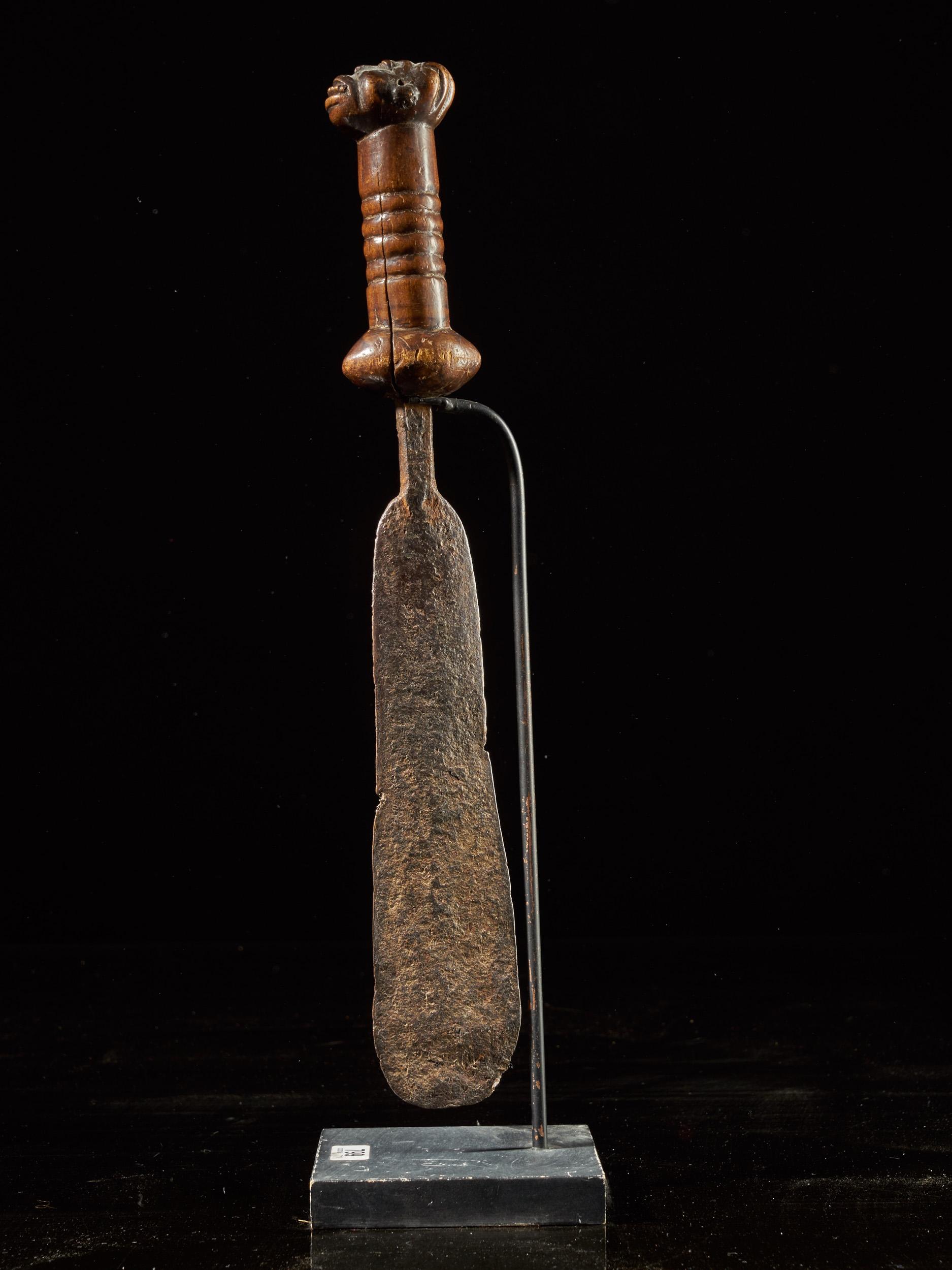 Solid forged Bamileke short sword with a finely carved face on the top of the handle. Patina of use