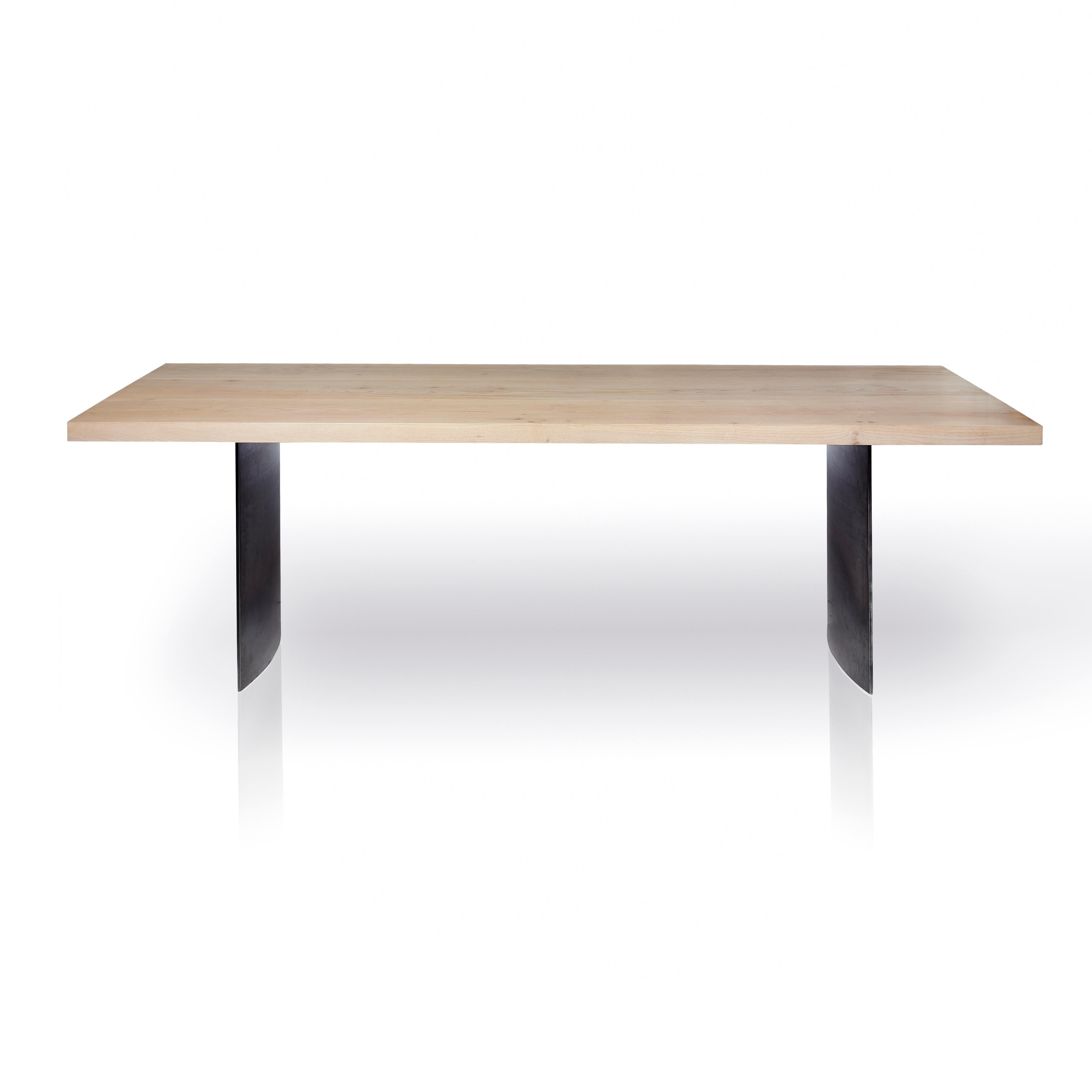 The Ban table uses whitewashed Western maple, influenced by Scandinavian design, set on 3/8