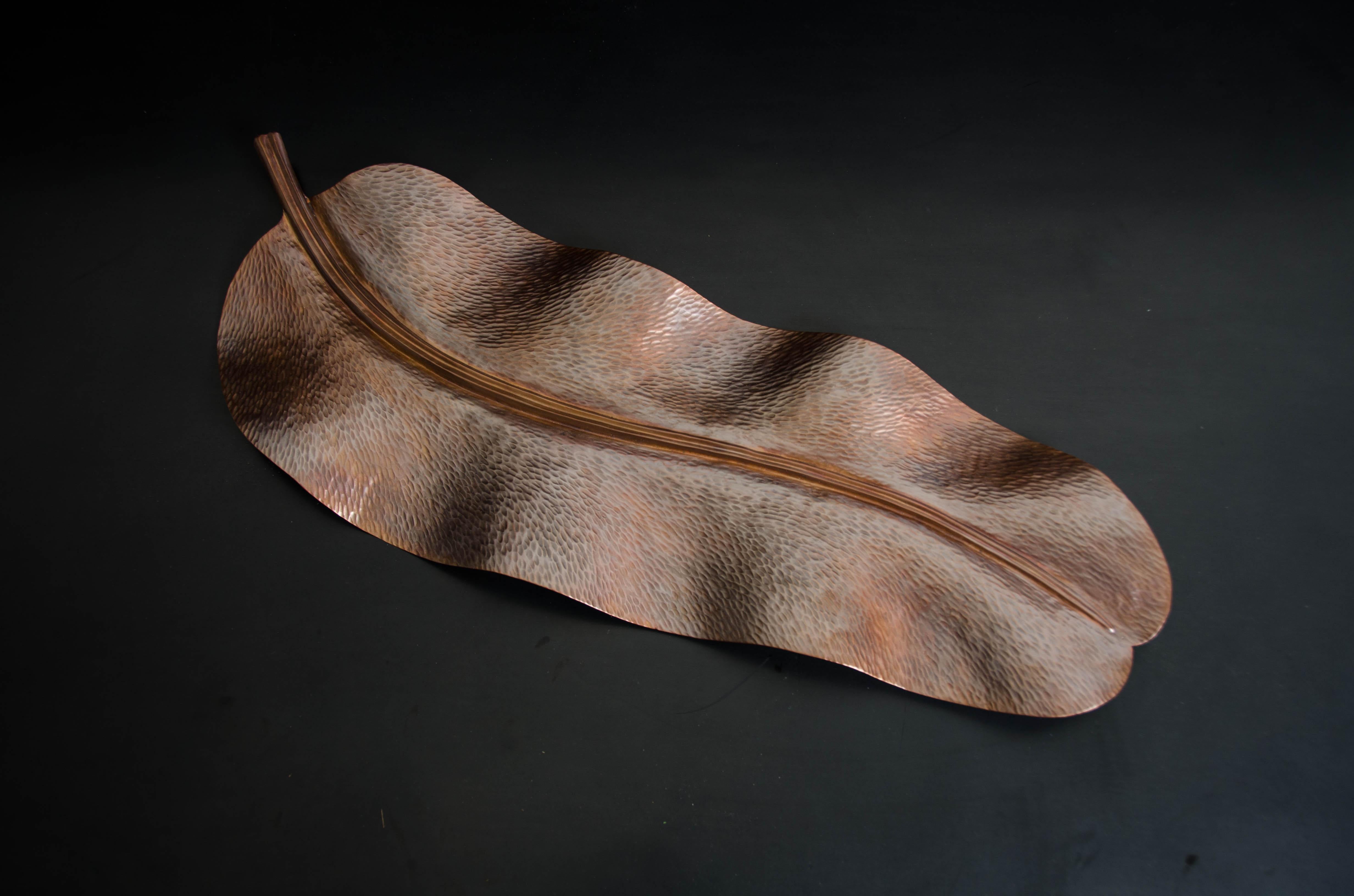 Banana leaf
Antique copper
Hand repousse
Limited Edition
Each piece is individually crafted and is unique.

Repousse is the traditional art of hand-hammering decorative relief onto sheet metal. The technique originated around 800 BC between
