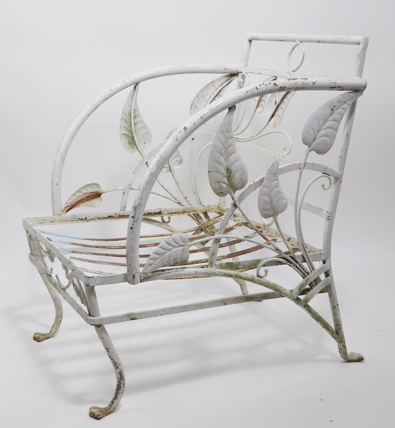 Rare Salterini garden, patio outdoor wrought iron lounge chair in the banana leaf pattern. This example is selling in original estate condition, the paint finish shows wear, and the cushions are missing. We offer custom powder coating if you prefer