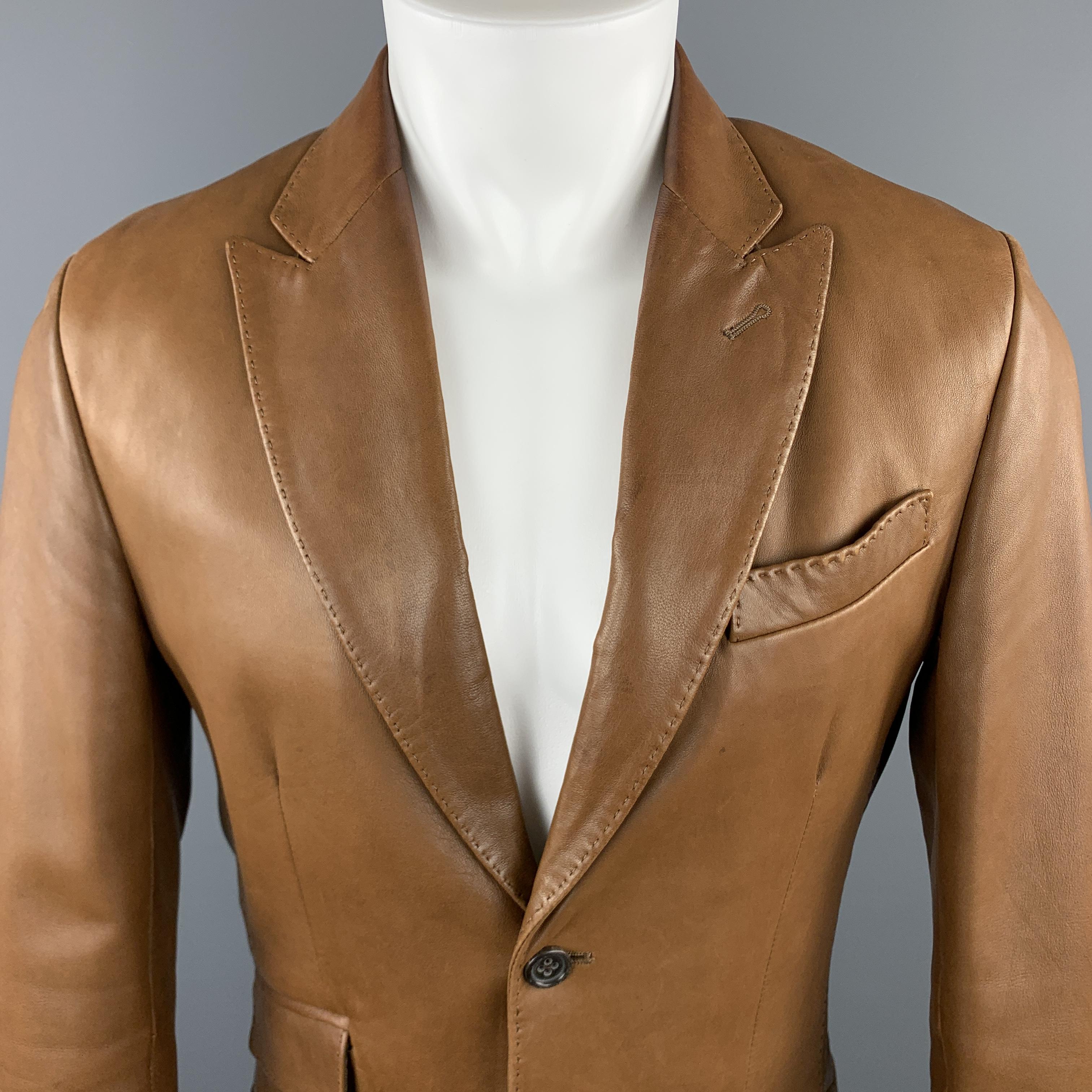 BANANA REPUBLIC sport coat comes in a solid brown leather material, with a peak lapel, two buttons at closure, single breasted, flap pockets, buttoned cuffs and a double vent at back. 

Excellent Pre-Owned Condition.
Marked: US