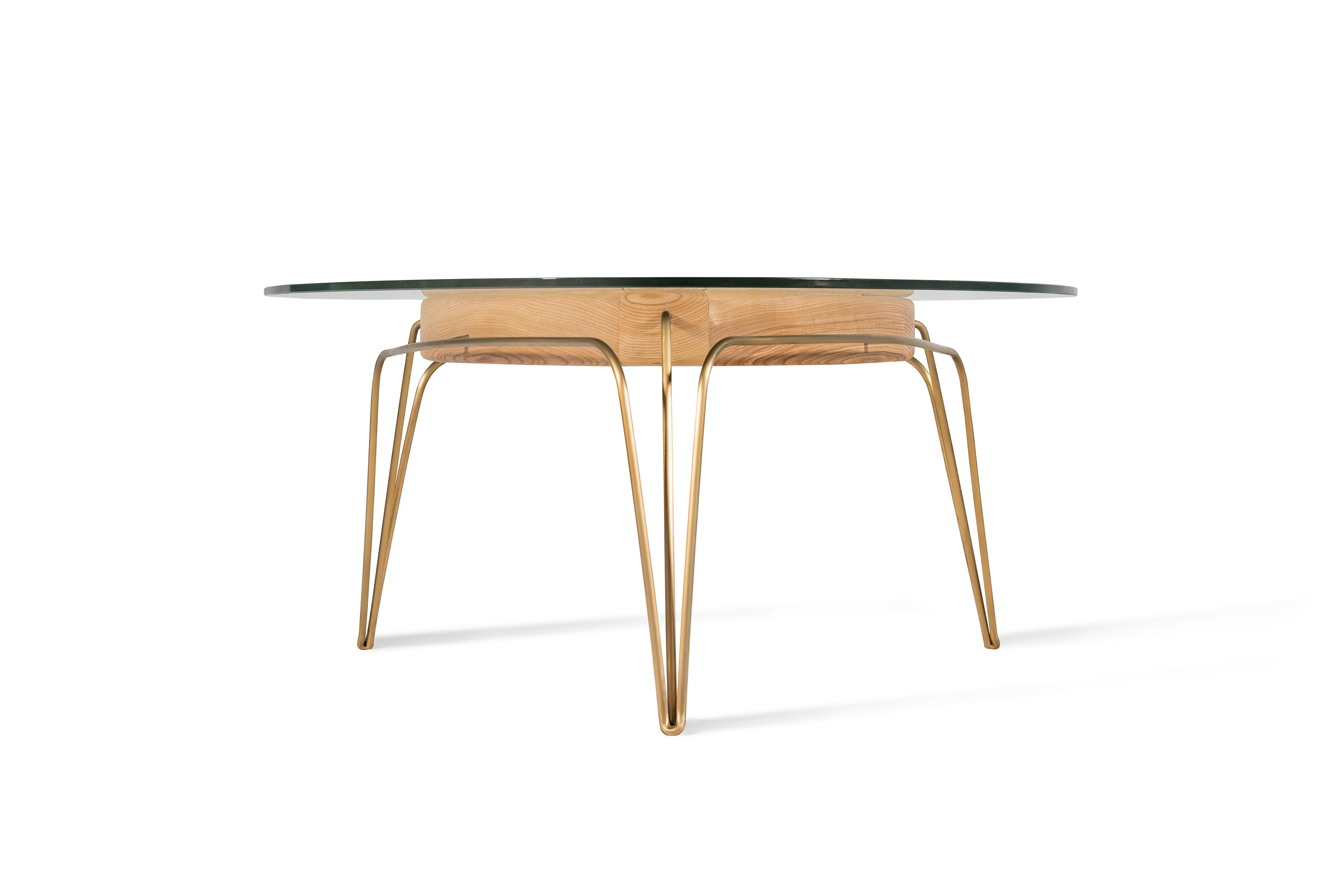 These gems for the sitting room cleverly combine, walnut, glass and a brass frame. Their two heights mean than when used together, they can form a cluster that
compliments the arrangement of sofas and armchairs.