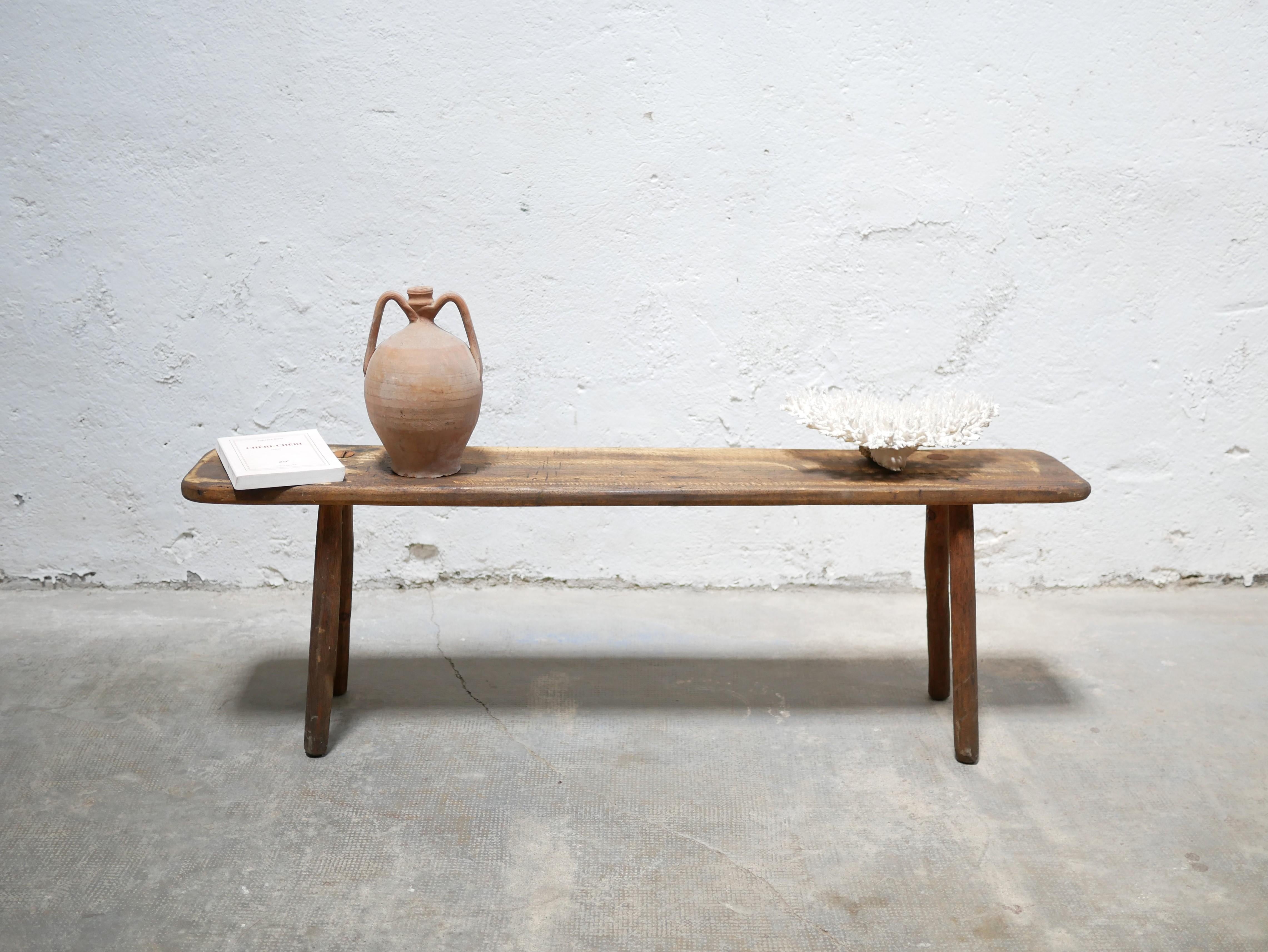 Handcrafted wooden bench.

Aesthetic and practical, the bench will find its place in the living room as a side table, in the entrance or even as a footboard in the bedroom.
Its natural material and its raw side make it a must for slow