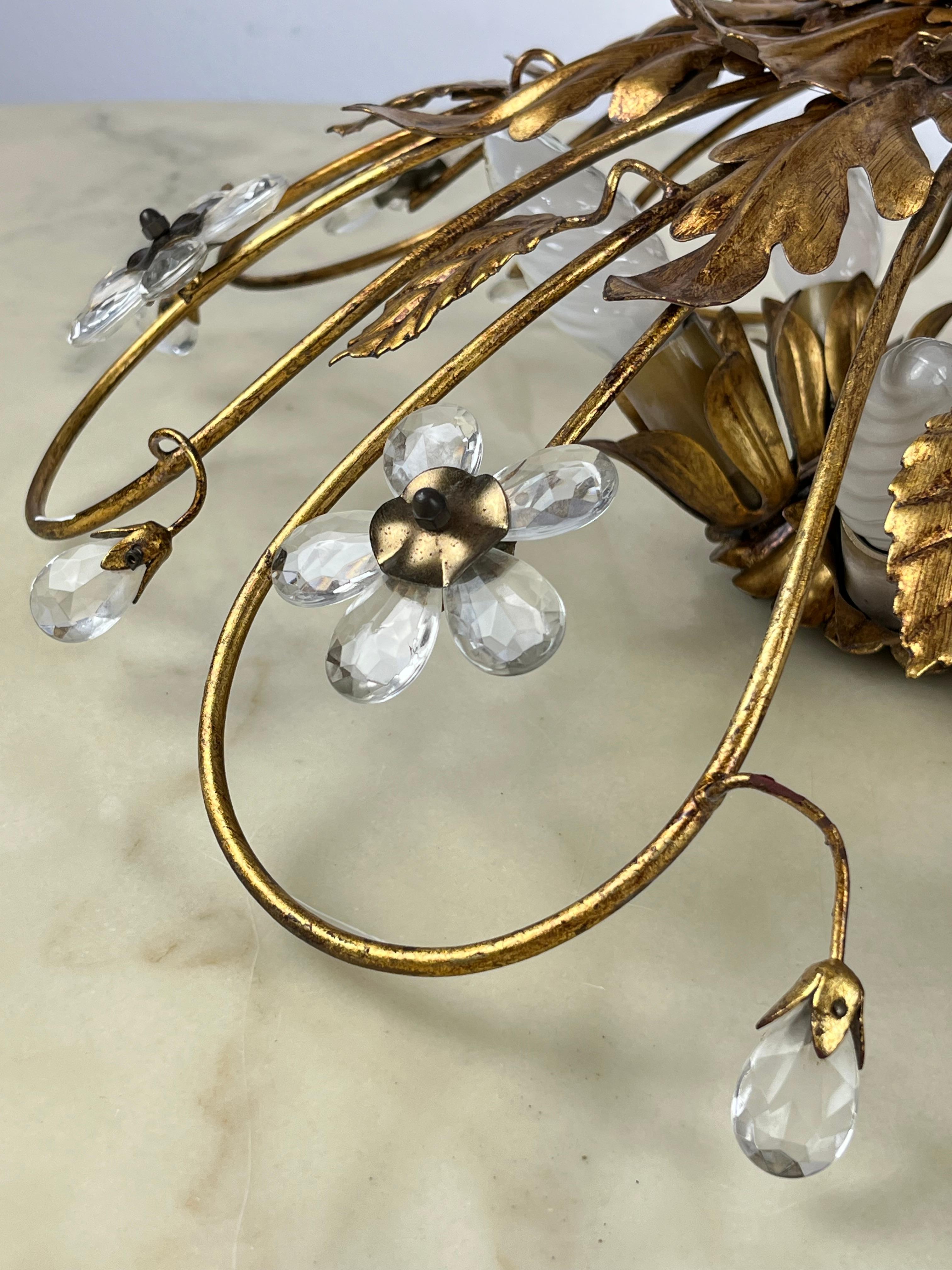 Banci ceiling light in gilded iron and crystal flowers, Italy, 1980s
Purchased in Florence, produced by the Banci company, it has 5 lights with E14 connection.
 It is perfectly intact and functional. Very good condition.