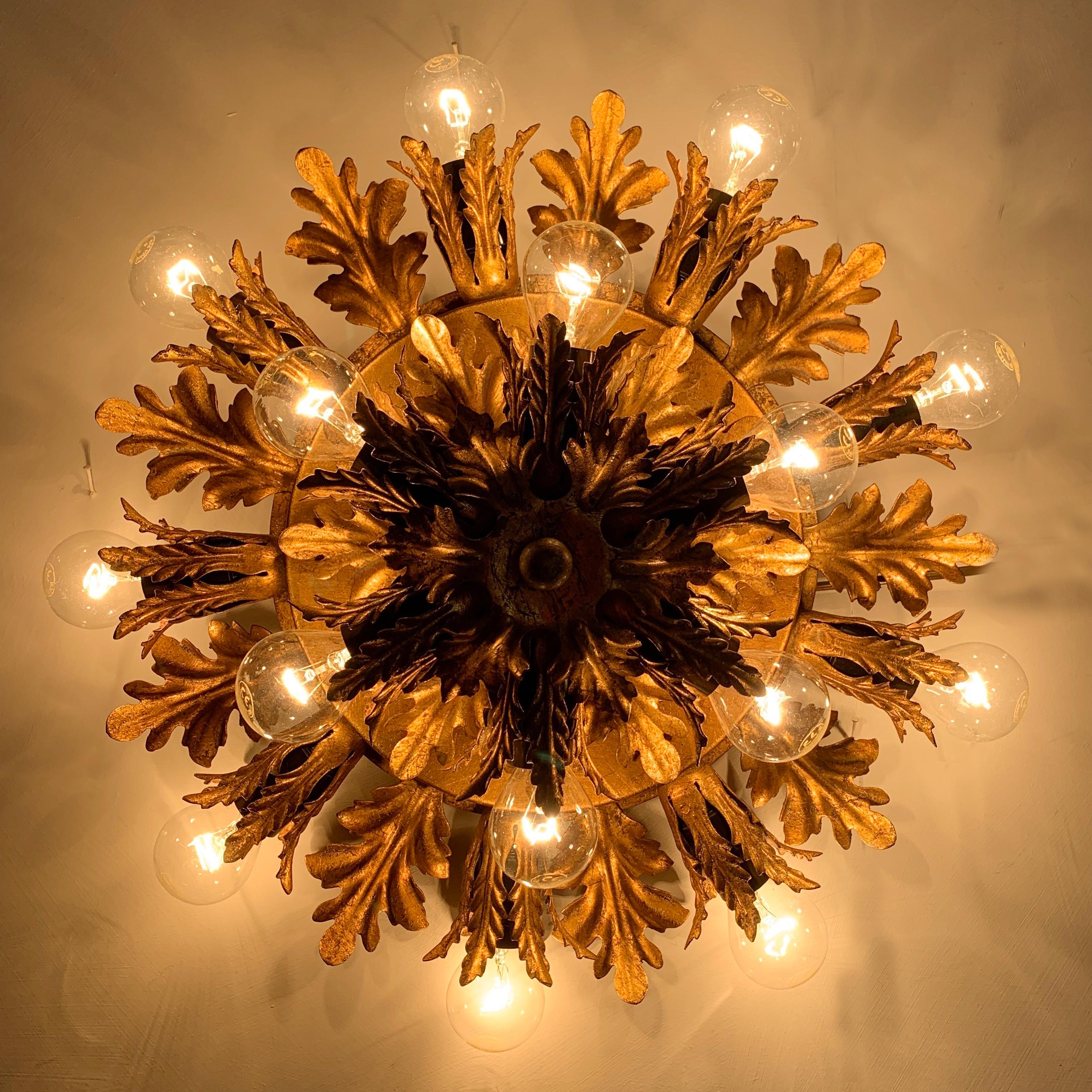 Italian florentine flushmount ceiling light
Banci Firenze, Italy, 1960s
Stunning gold acanthus leaf design
Gold leaf finish
42cm width 13cm depth (protrusion from ceiling)
Double layer of bulbs
9 bulb holders in the outer layer, 6 in the top