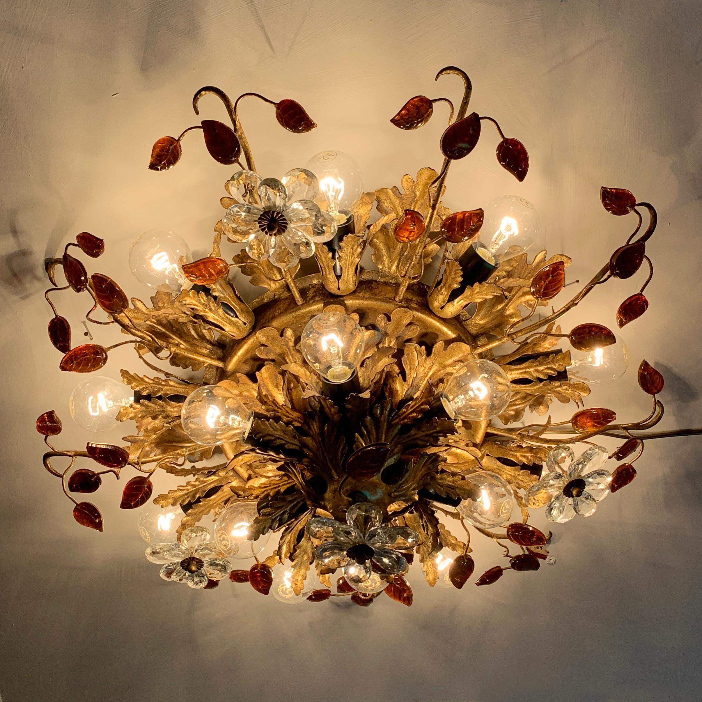 Italian florentine flushmount ceiling light
Banci Firenze, Italy, circa 1960s
Double layered, top layer featuring 6 bulb holders, lower layer 9 bulb holders
Stunning gilt acanthus leaf design with clear Murano glass flowers and amber Murano glass