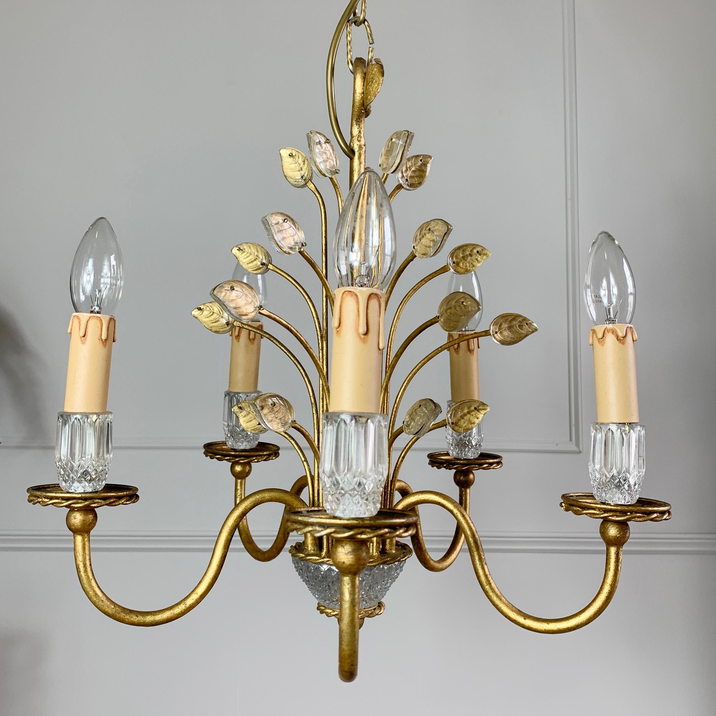 Striking gilt and glass Banci Firenze chandelier, Italian 1970’s. This beautiful chandelier is hand crafted using Murano glass leaves set into a gilt iron body, to the bottom is an incredibly detailed rock crystal base, bearing five lamp holders,