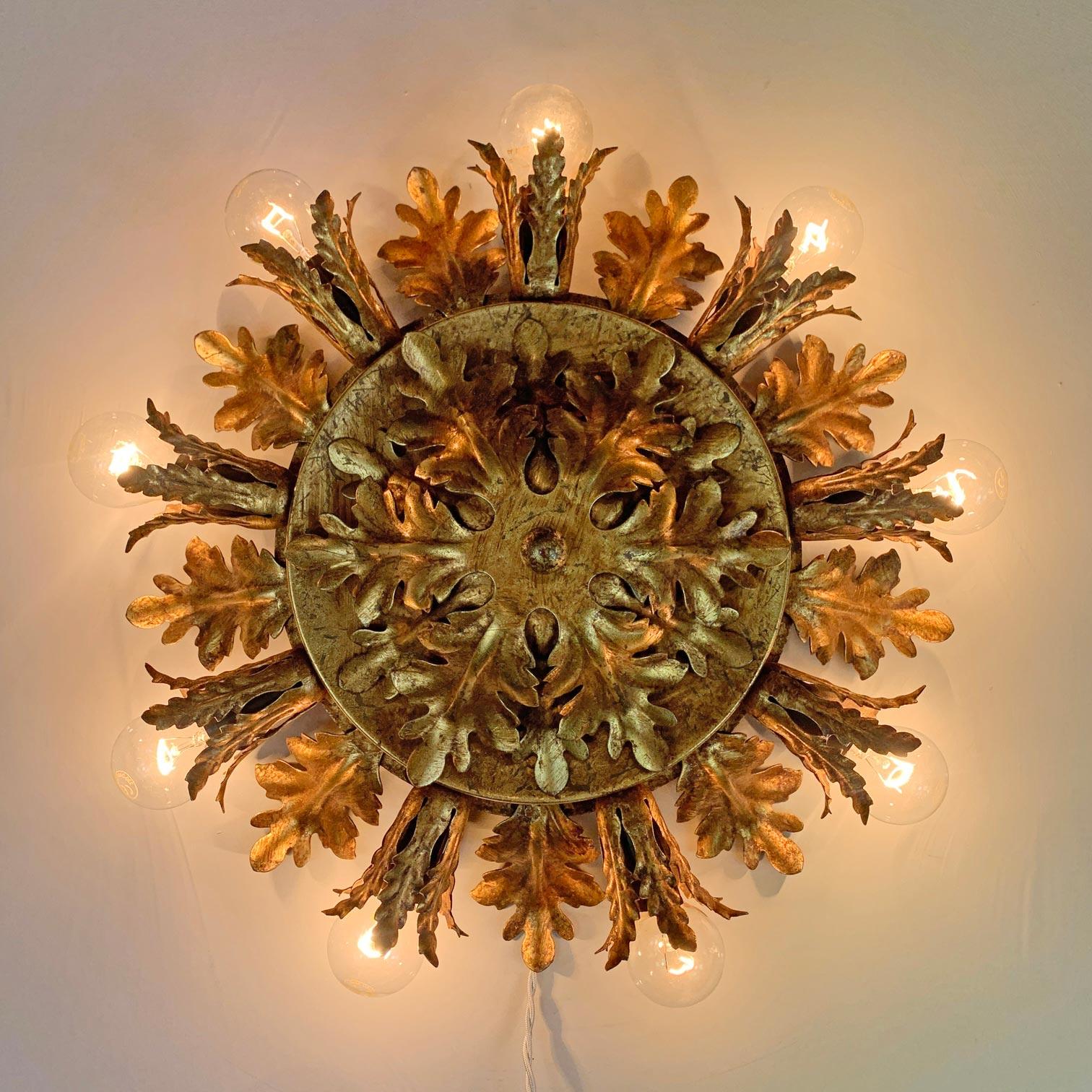 Italian Florentine flush mount ceiling light, Banci Firenze, Italy, 1950's 

Stunning gold acanthus leaf design in original iron gilt finish.

 Measures: 40 cm width 11 cm depth (protrusion from ceiling).

 9 Bulb holders, E14 small screw