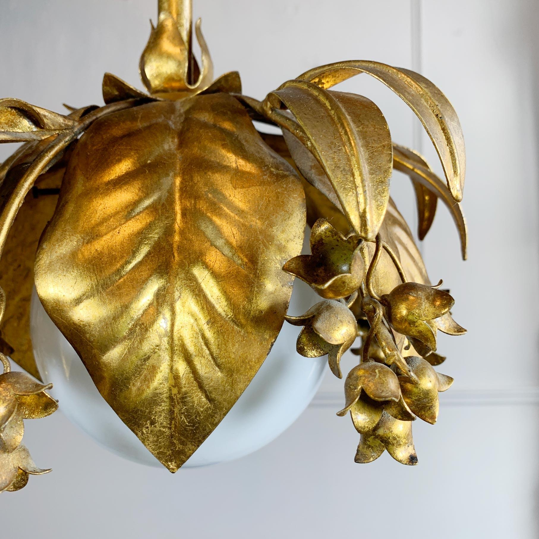 Beautifully decorative gilt Banci Firenze pendant light, in the form of wisteria flower bells, the single lamp holder sits behind the central opaque glass globe.

Italy, 1970's.

Height 88cm x Width 30cm

Chain 35cm Rose 12cm Width

Globe