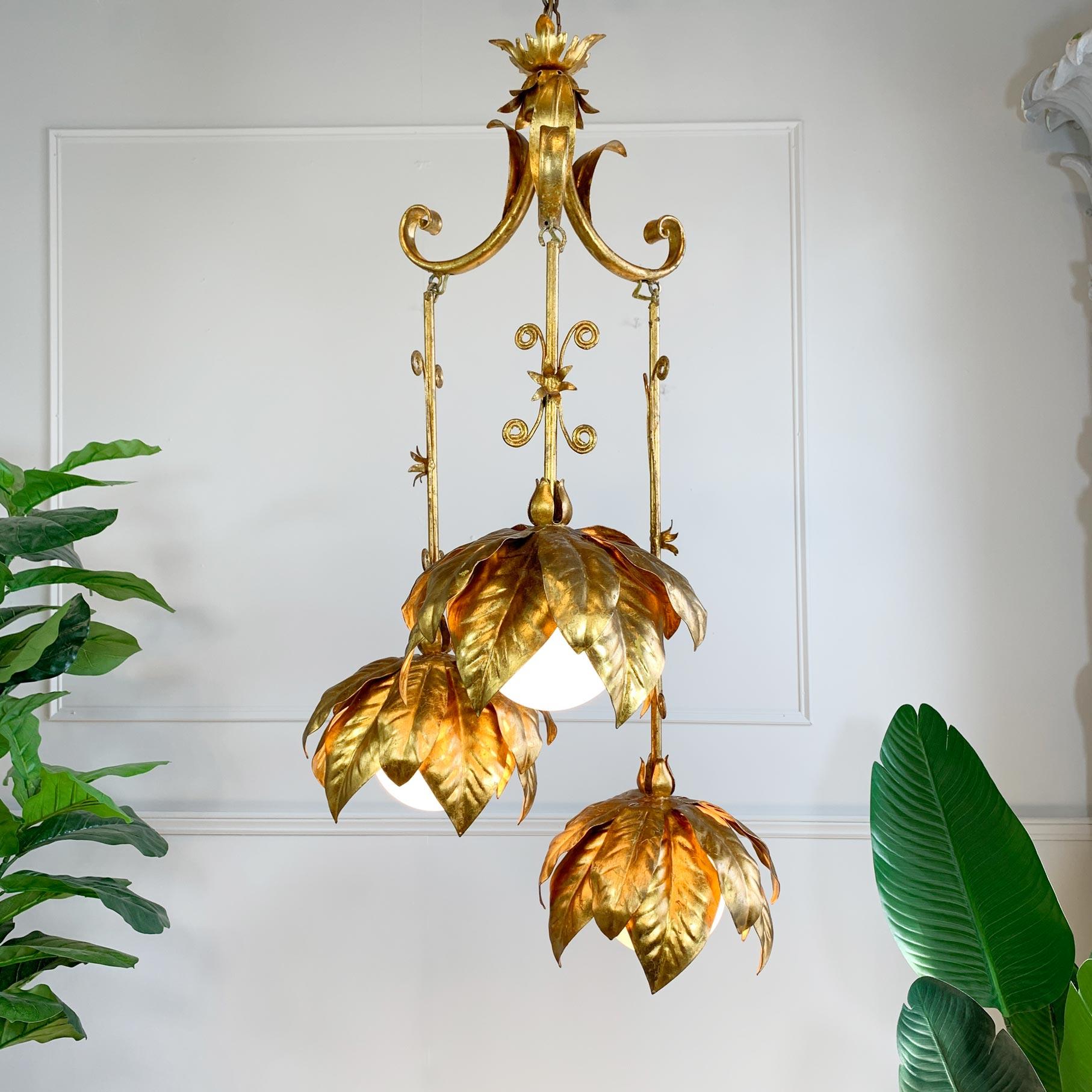 Beautifully decorative and very rare, gold leaf gilt Banci Firenze triple pendant light, in the form of large flower heads, the three e14 lamp holders sit behind opaque glass globes.

Made by the world renowned design house Banci Firenze, Italy,