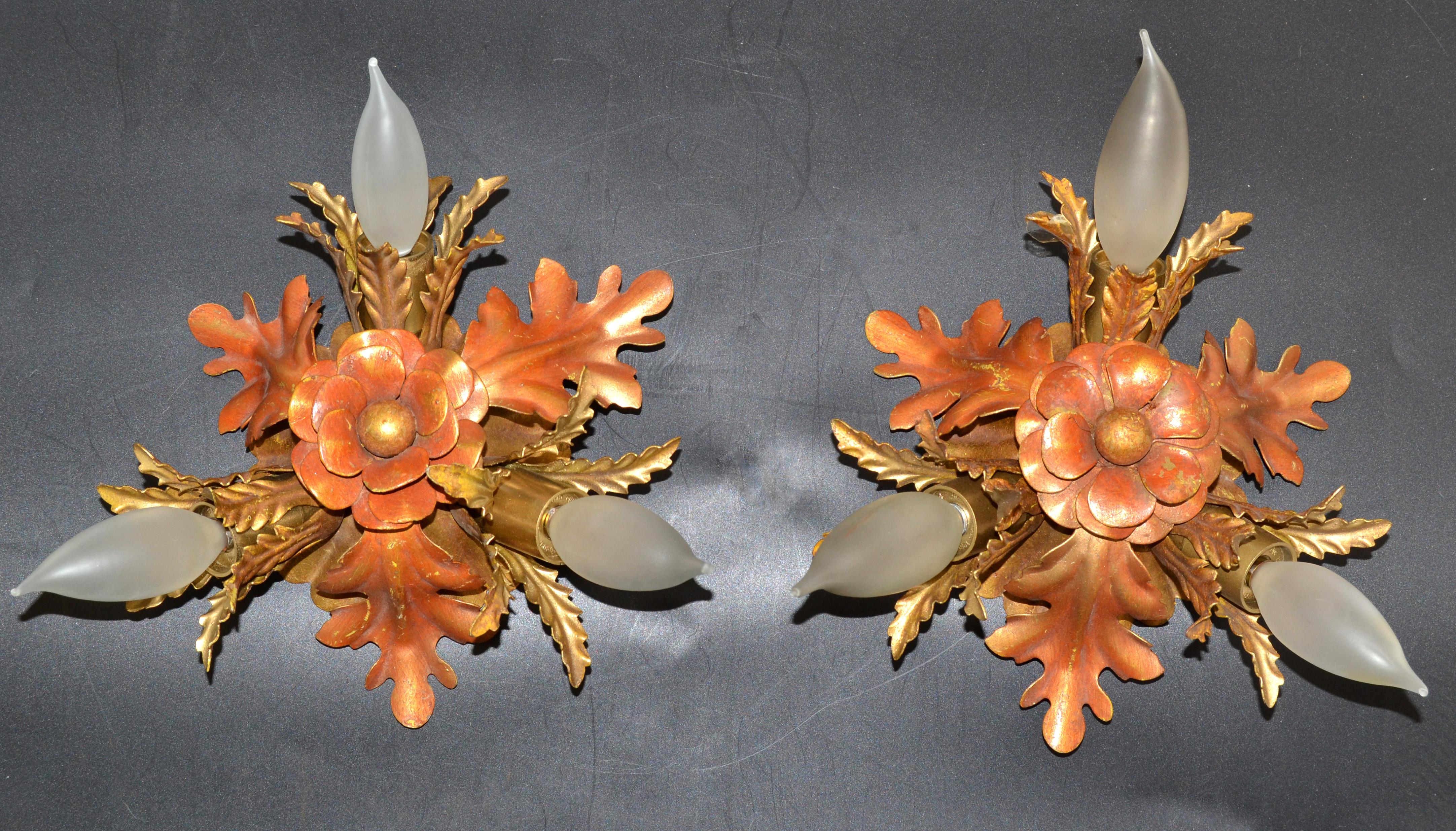 Superb set of two Italian sconces, wall lights by Banci Firenze made in 1965.
Handcrafted Brass and Steel leaves and Flowers mounted on a round Back Plate.
US Rewiring and each Sconce takes 3 candelabra light bulbs with max 25 watts.  
Back Plate