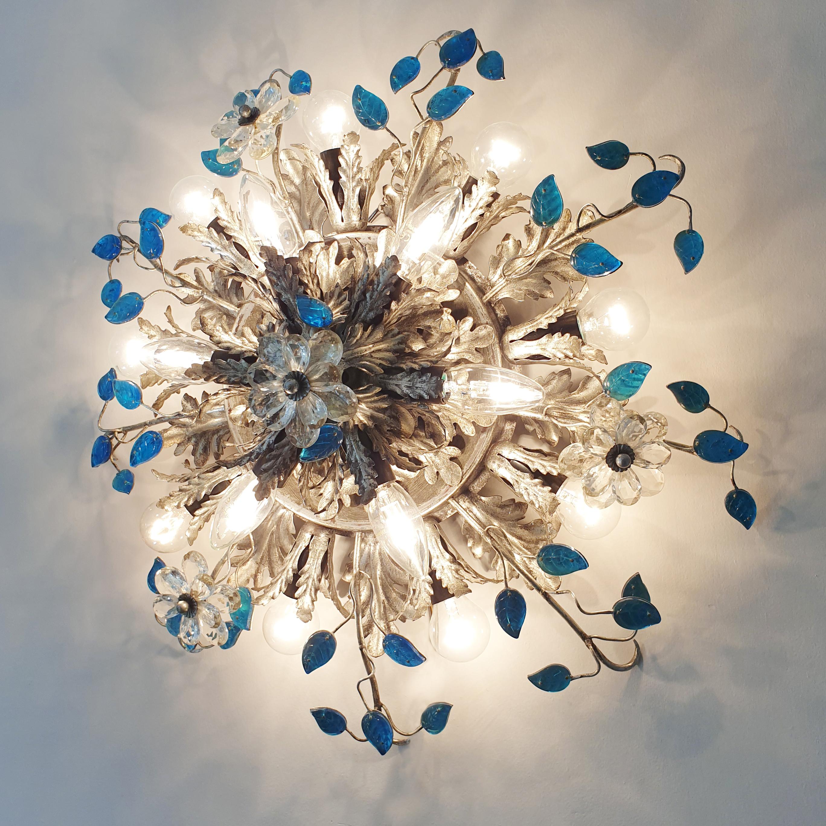Italian Florentine flushmount ceiling light
Banci Firenze, Italy, 1960s
Double layered, top layer featuring 6 bulb holders, lower layer 9 bulb holders
Stunning silver acanthus leaf design with clear Murano glass flowers and turquoise Murano glass