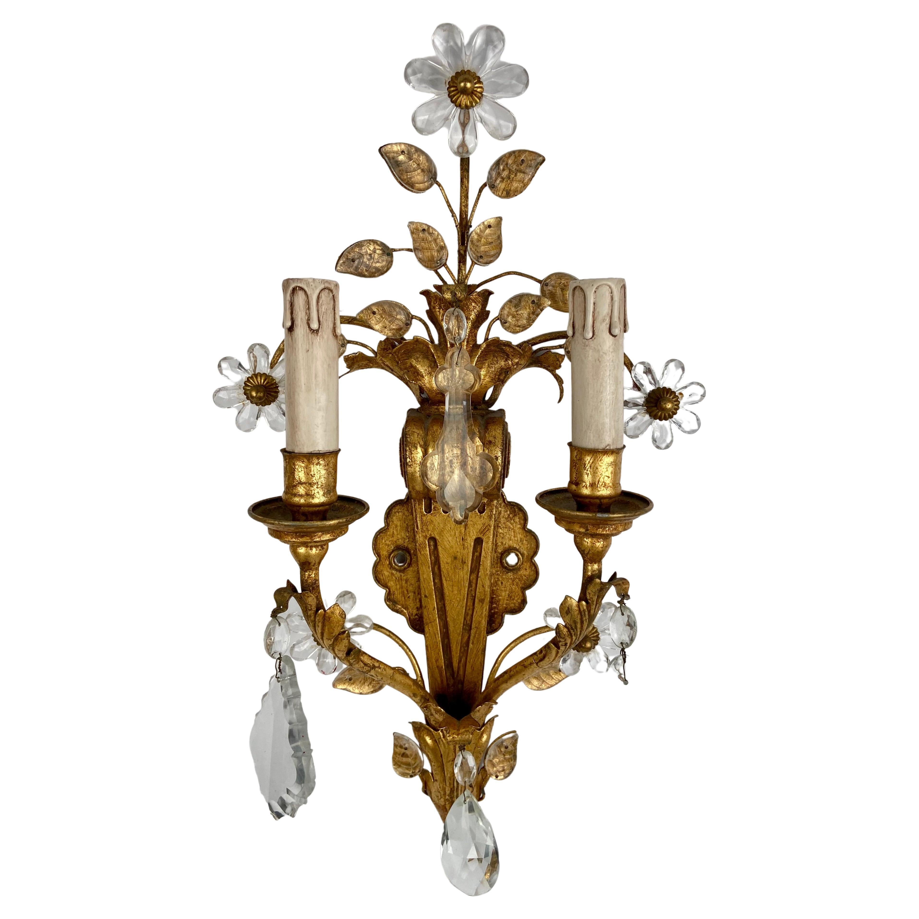 A gilt and silvered metal two branch wall light from Banci, Florence, Italy.
The backplate shaped in the form of e reeded volute, the top emitting a tree of life cresting with applied glass leaves and flowers tom gilt metal branches. 
The base with