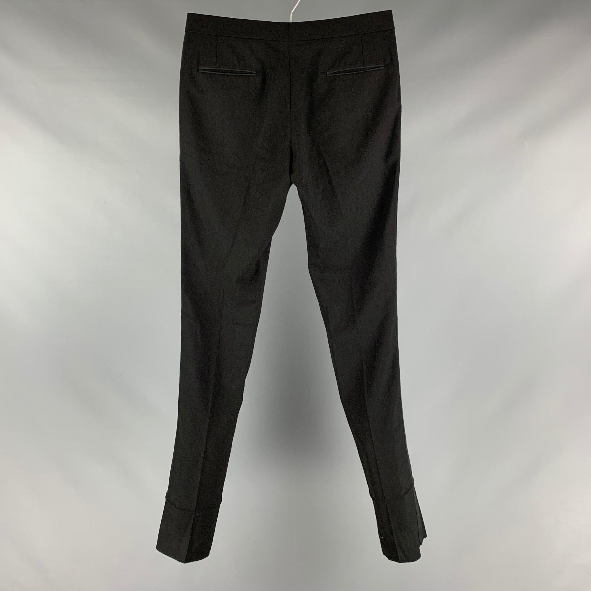 BAND OF OUTSIDERS dress pants comes in a black wool woven material featuring a
 tuxedo stripe, front tab, and a zip fly closure. Made in USA.Excellent Pre-Owned Conditions. 

Marked:  32 

Measurements: 
 Waist: 32 inches Rise: 8.5 inches Inseam: 38