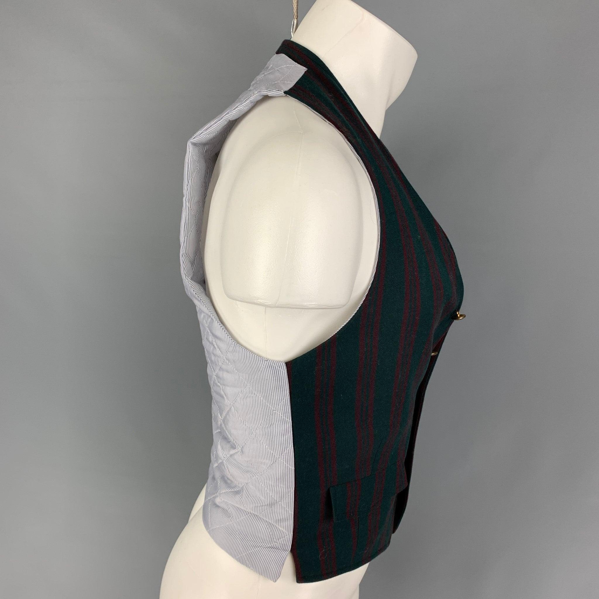 BAND OF OUTSIDERS vest comes in a green & burgundy stripe wool with a quilted back featuring flap pockets and a buttoned closure. Made in USA.
Very Good
Pre-Owned Condition. 

Marked:   2 

Measurements: 
 
Shoulder: 10.5 inches  Chest: 34 inches 