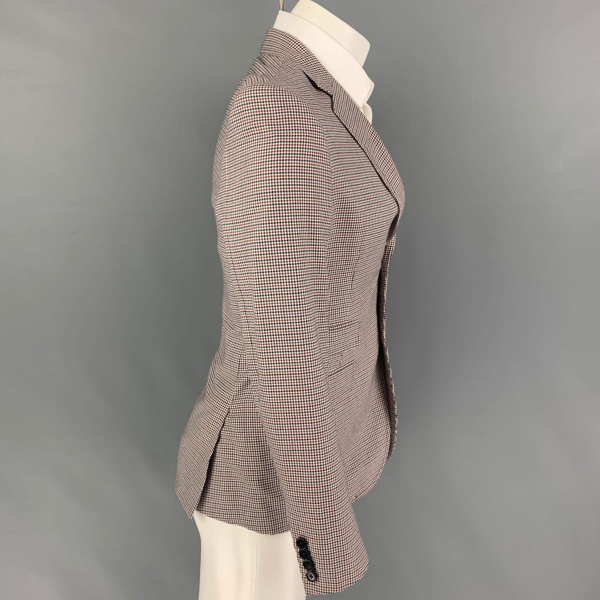 BAND OF OUTSIDERS
sport coat comes in a white & navy houndstooth wool with a full liner featuring a notch lapel, flap pockets, double back vent, and a double button closure. Made in USA. Very Good Pre-Owned Condition.  

Marked:   1 

Measurements: