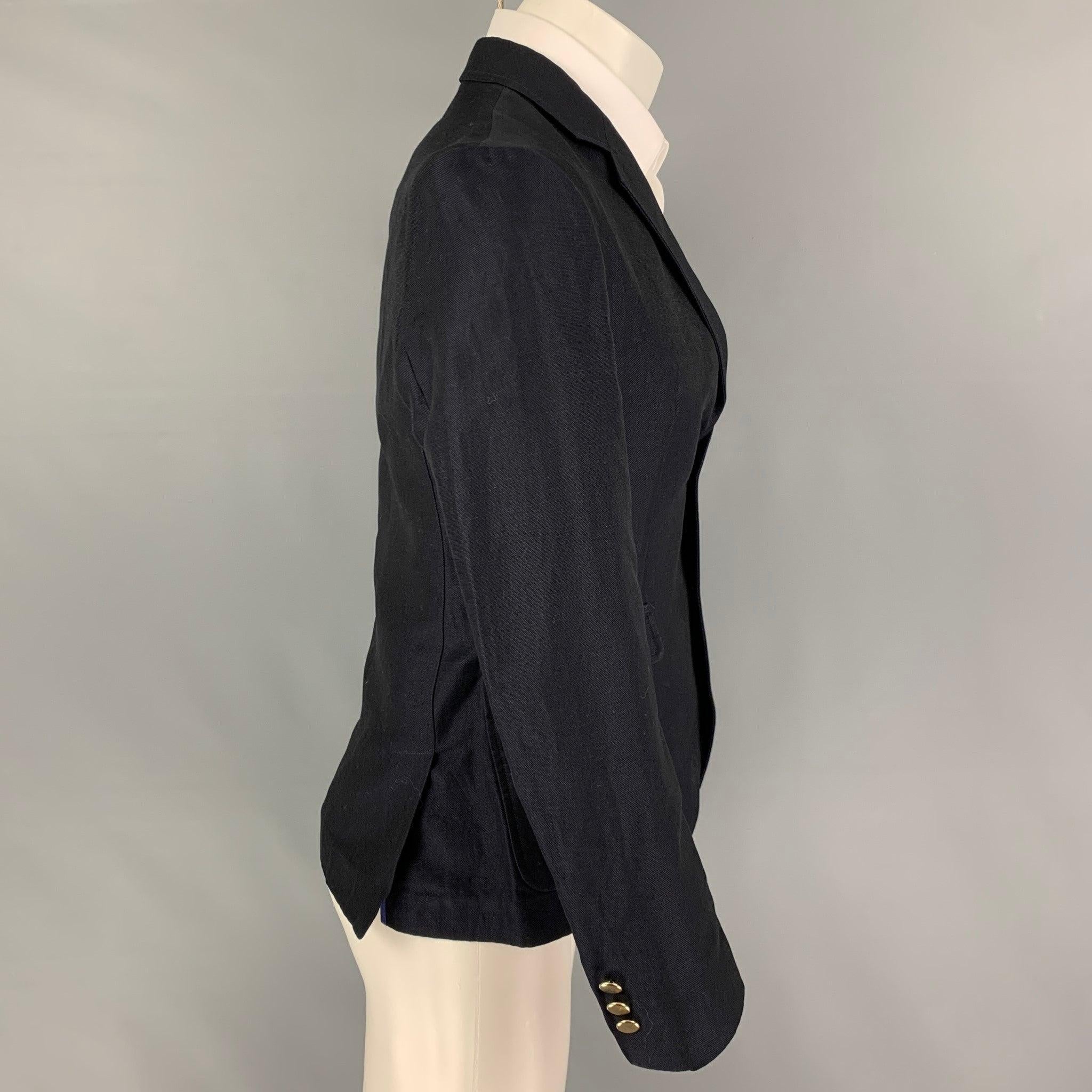 BAND OF OUTSIDERS
sport coat comes in a navy linen with a half liner featuring a notch lapel, flap pockets, double back vent, and a three button closure.Good Pre-Owned Condition. Missing one button. As-is.  

Marked:   1 

Measurements: 
 
Shoulder: