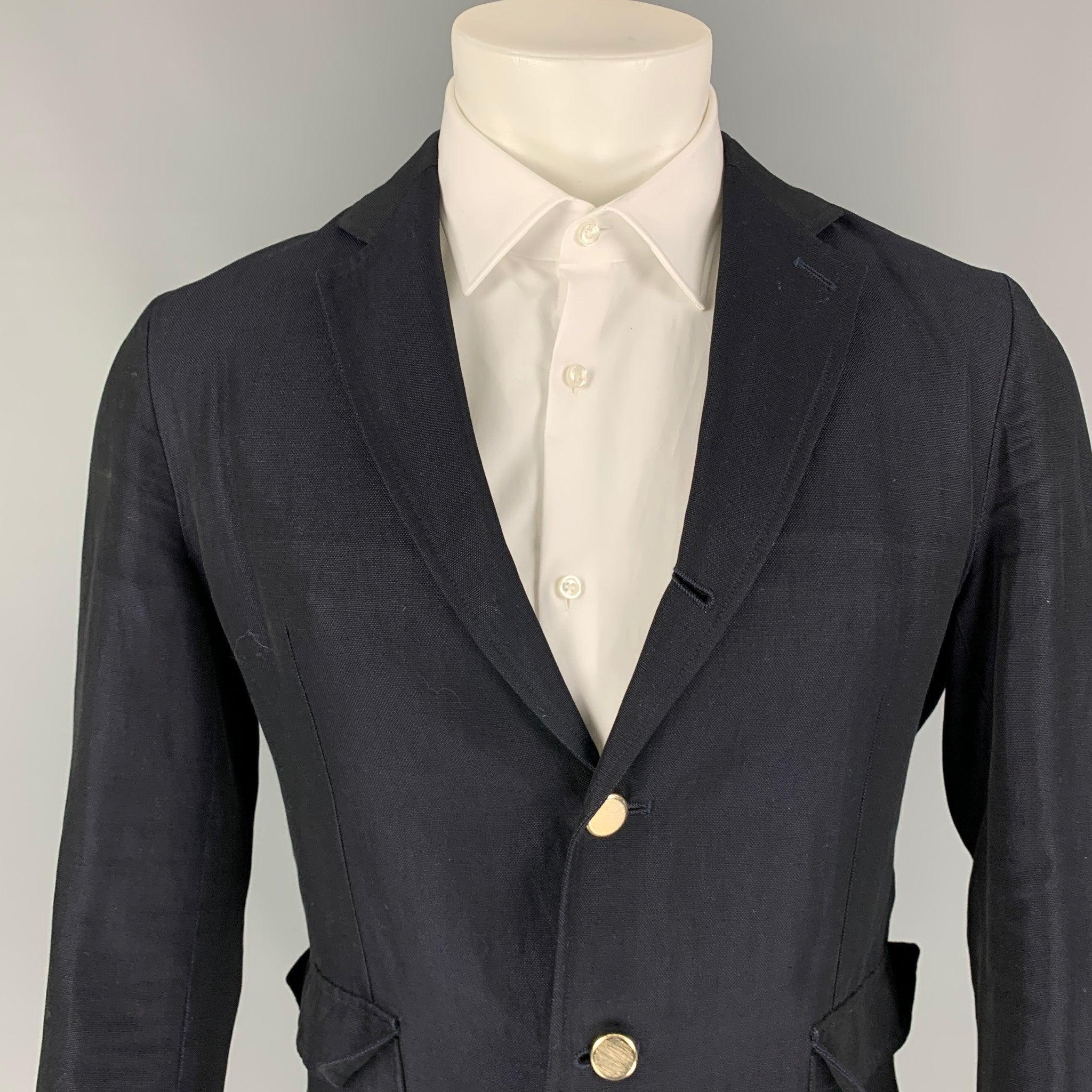 BAND OF OUTSIDERS sport coat comes in a navy cotton / linen with a half liner featuring a notch lapel, double back vent, patch pockets, and a three button closure. Made in Italy.
Good
Pre-Owned Condition. Minor wear throughout.  

Marked:   2