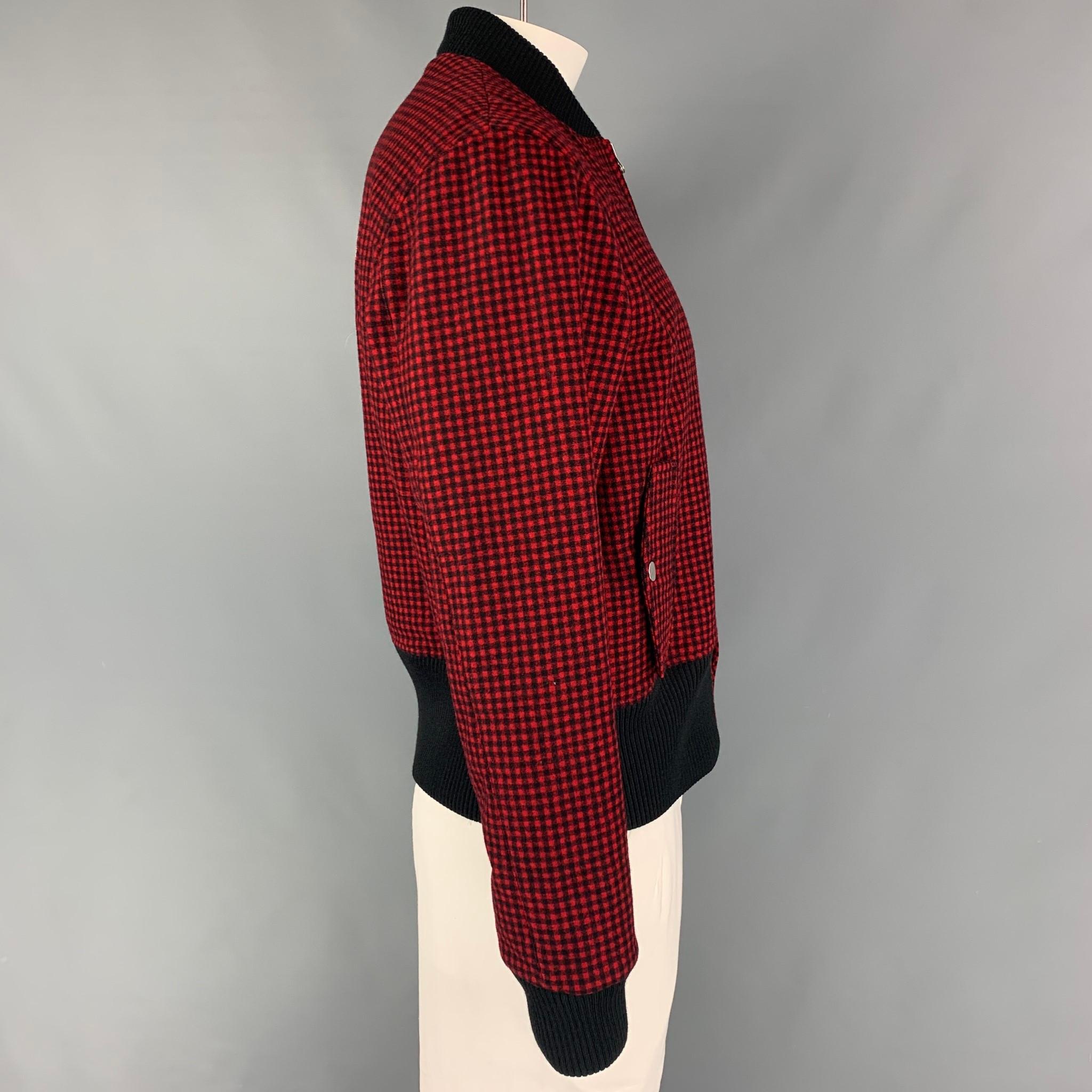 BAND OF OUTSIDERS jacket comes in a red & black checkered wool featuring a bomber style, ribbed hem, embroidered back design, flap pockets, and a zip up closure.

Excellent Pre-Owned Condition. Fabric tag removed.
Marked: Size tag