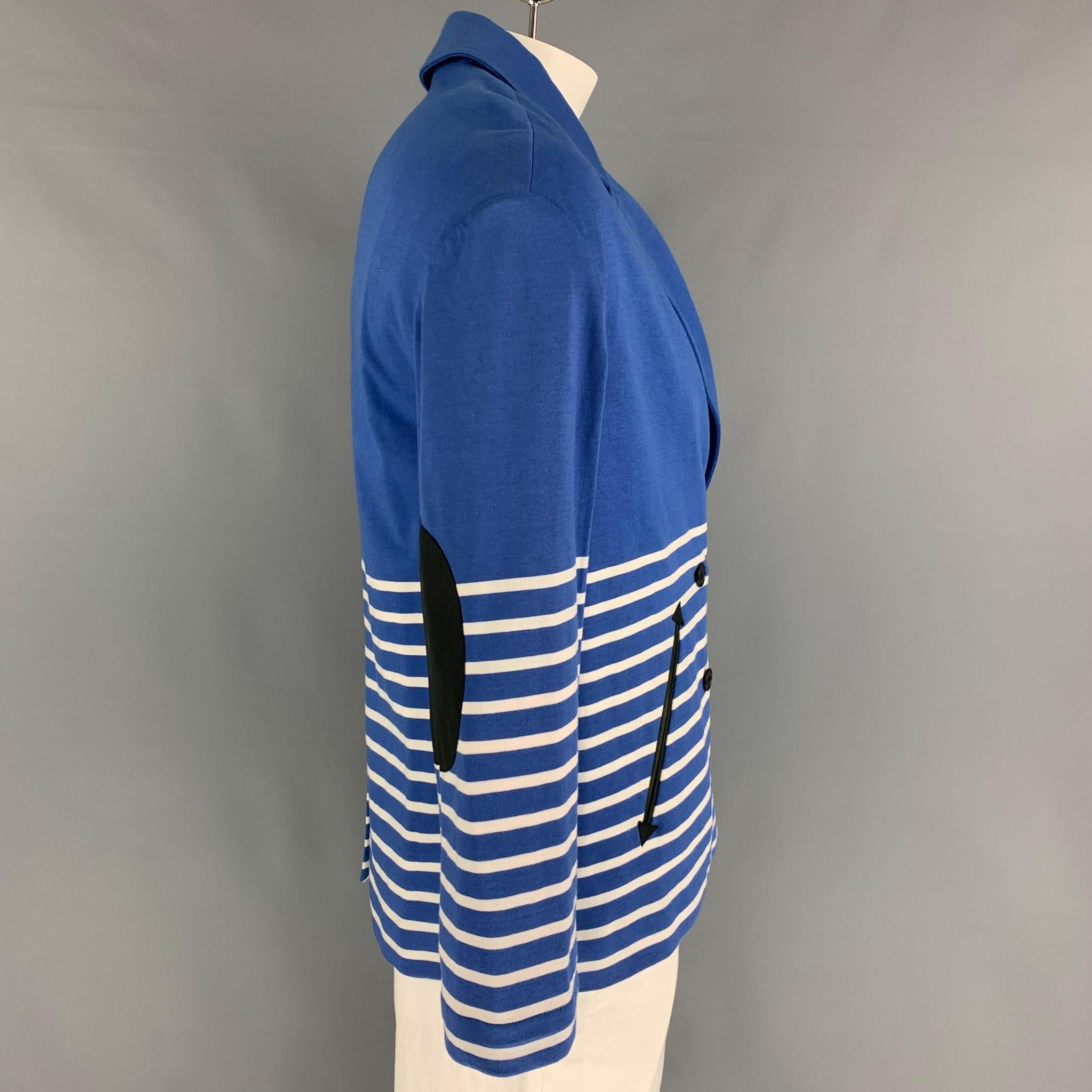 BAND OF OUTSIDERS jacket comes in a blue & white stripe cotton featuring a notch lapel, leather elbow patches, single back vent, and a double breasted closure. Made in Italy.

Very Good Pre-Owned Condition.
Marked: 3

Measurements:

Shoulder: 21