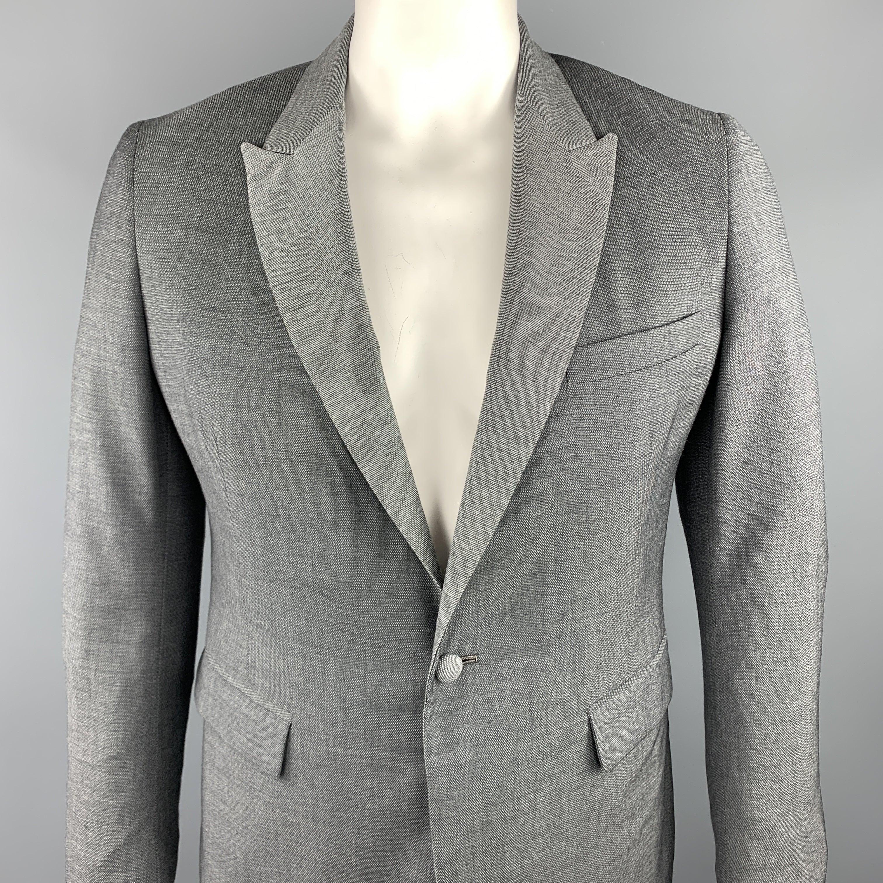 BAND OF OUTSIDERS sport coat comes in a gray nailhead wool featuring a peak lapel style, flap pockets, and a single button closure. Hand Tailored in USA.
Excellent
Pre-Owned Condition. 

Marked:   US 42 

Measurements: 
 
Shoulder: 17 inches 
Chest: