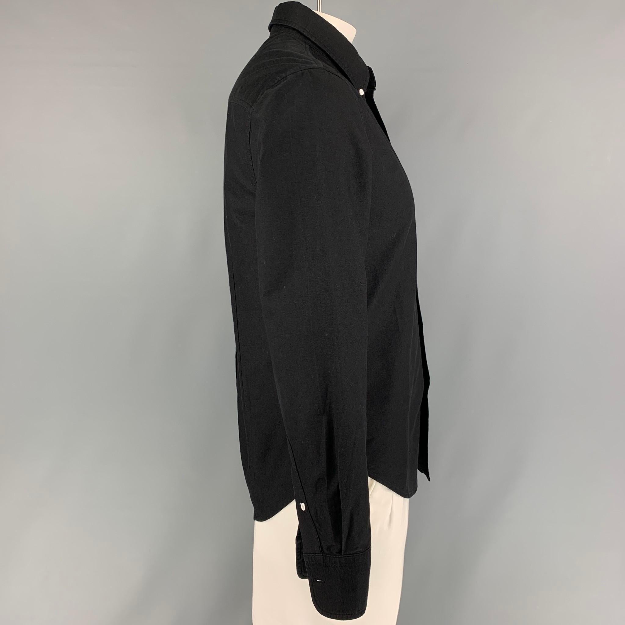 BAND OF OUTSIDERS long sleeve shirt comes in a black cotton featuring a button down collar, patch pocket, and a button up closure. 

Very Good Pre-Owned Condition.
Marked: L

Measurements:

Shoulder: 18 in.
Chest: 40 in.
Sleeve: 26 in.
Length: 28.5