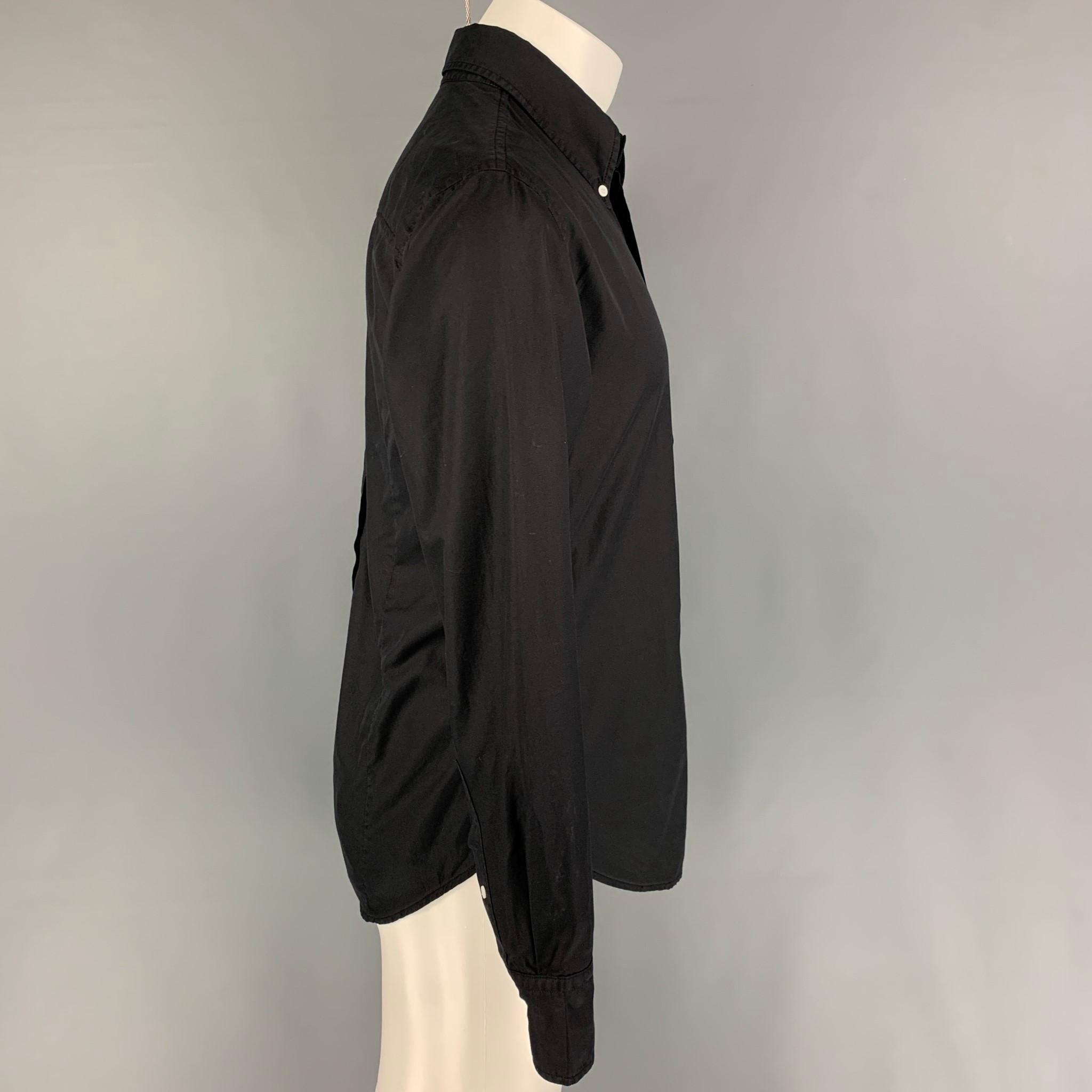 BAND OF OUTSIDERS long sleeve shirt comes in a black material featuring a button down collar, patch pocket, and a button u closure. 

Very Good Pre-Owned Condition. Fabric tag removed.
Marked: 3

Measurements:

Shoulder: 18 in.
Chest: 40 in.
Sleeve: