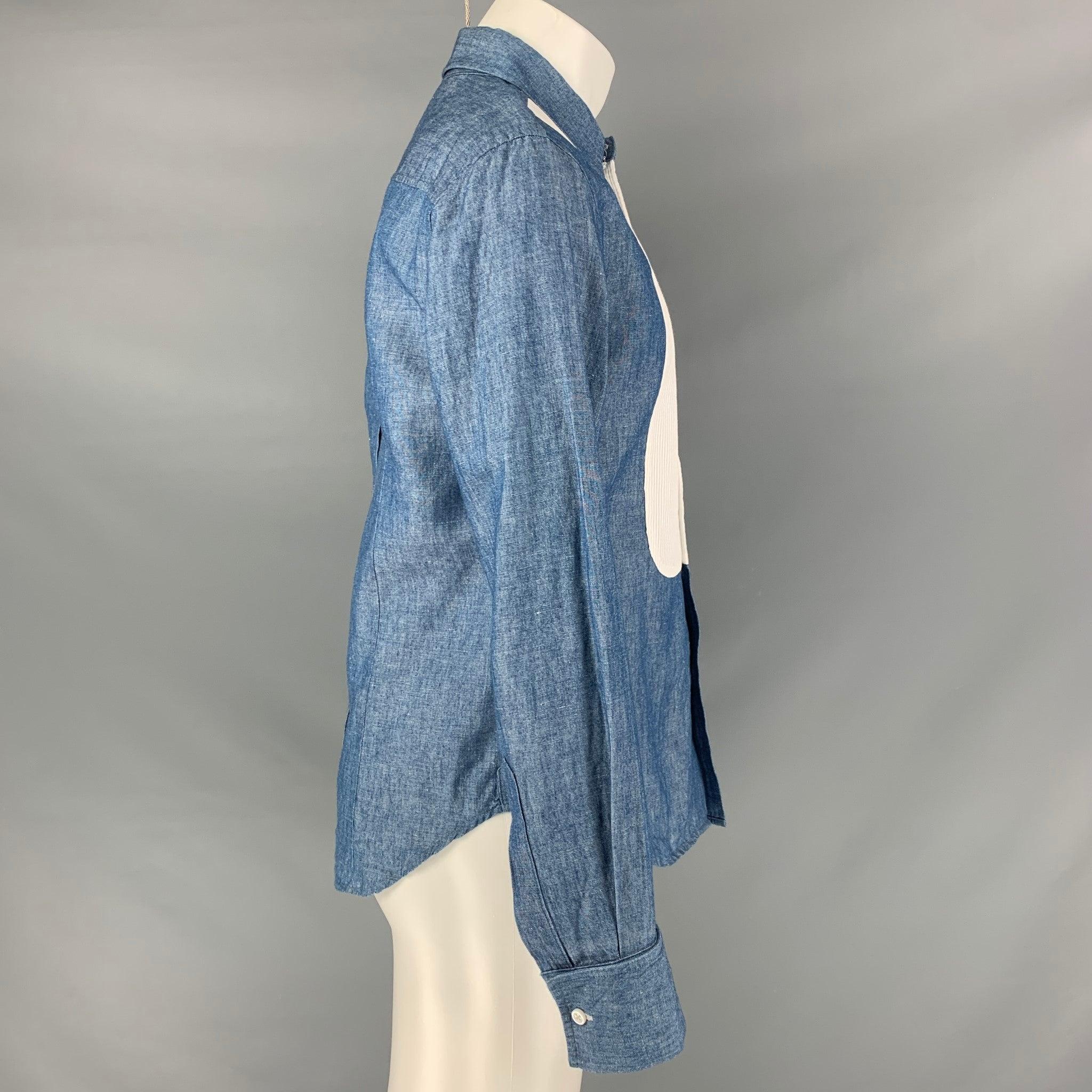 BAND OF OUTSIDERS long sleeve shirt comes in a blue chambray cotton fabric featuring a white tuxedo detail at front, straight collar, and a button down closure. Made in USA.Excellent Pre-Owned Condition. 

Marked:   M 

Measurements: 
 
Shoulder: 18