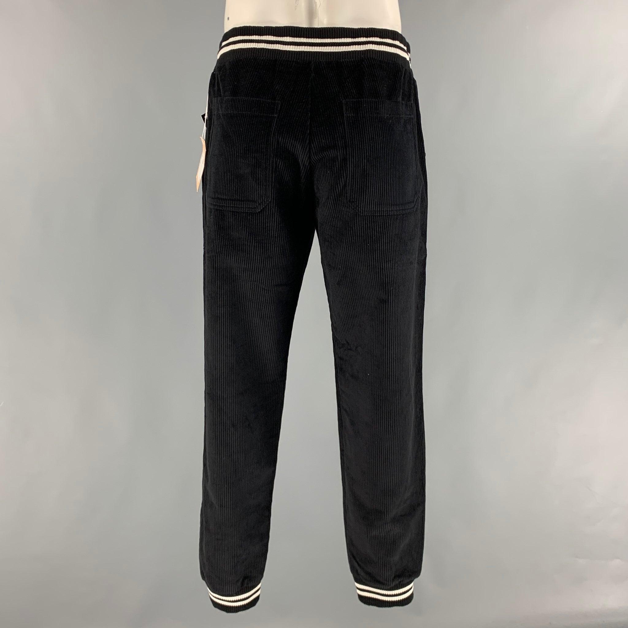 BAND OF OUTSIDERS sweatpants in a black corduroy cotton material featuring black and white ribbed accents, a drawstring waistband and an elastic hem.New with Tags. 

Marked:   XL 

Measurements: 
  Waist: 33 inches Rise: 10 inches Inseam: 30.5