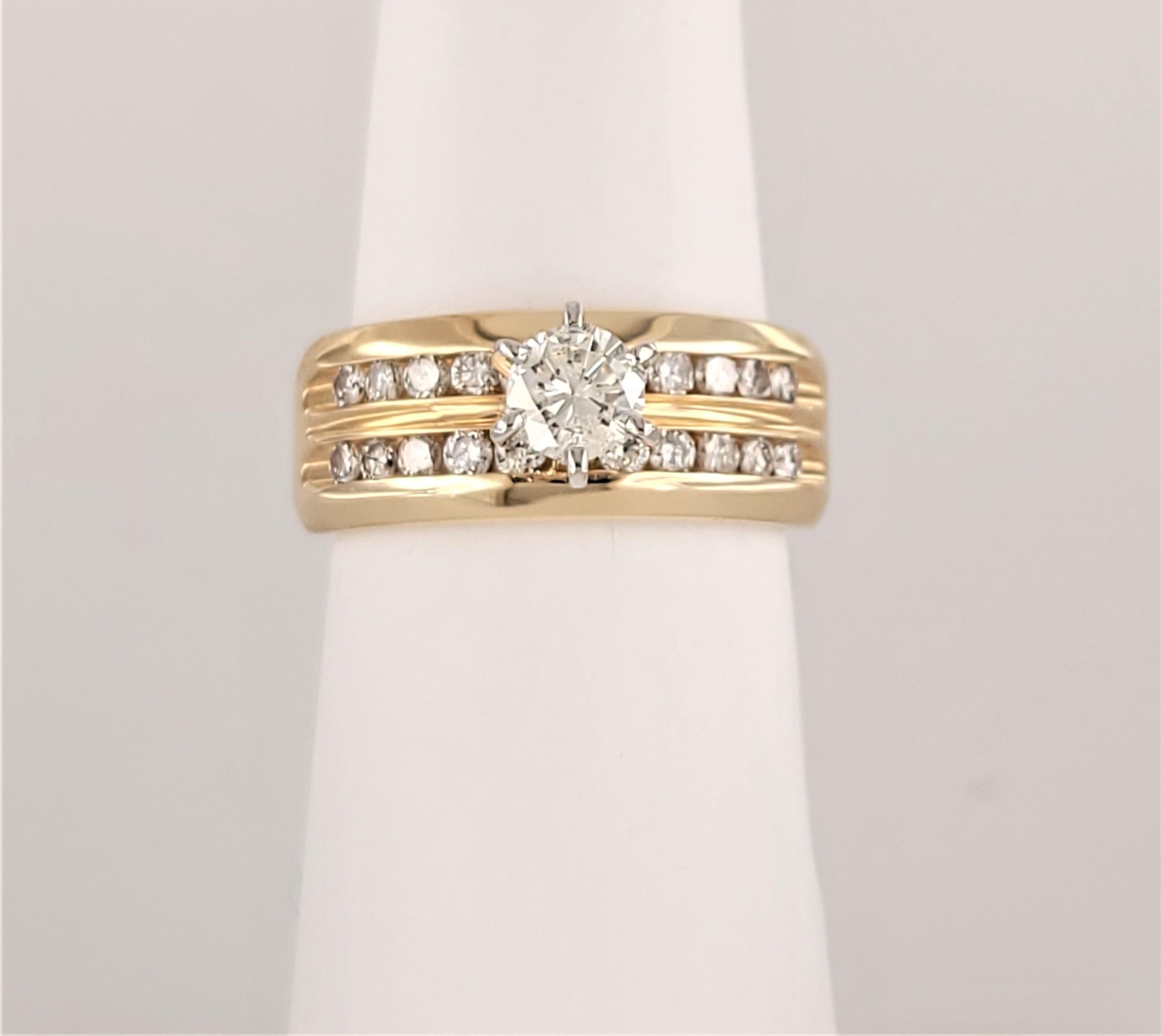 Unbranded Band Ring with Diamonds
Material 14K yellow Gold 
Ring Size 6.75
Band Width 7.8mm 
Shank of the Ring is 4.3mm 
Ring Weight 7.4gr 
Center Stone .30ct
Diamond Clarity SI1 / G color 
20pcs Side Stones are .08ct 
Diamond Clarity VS
Color Grade