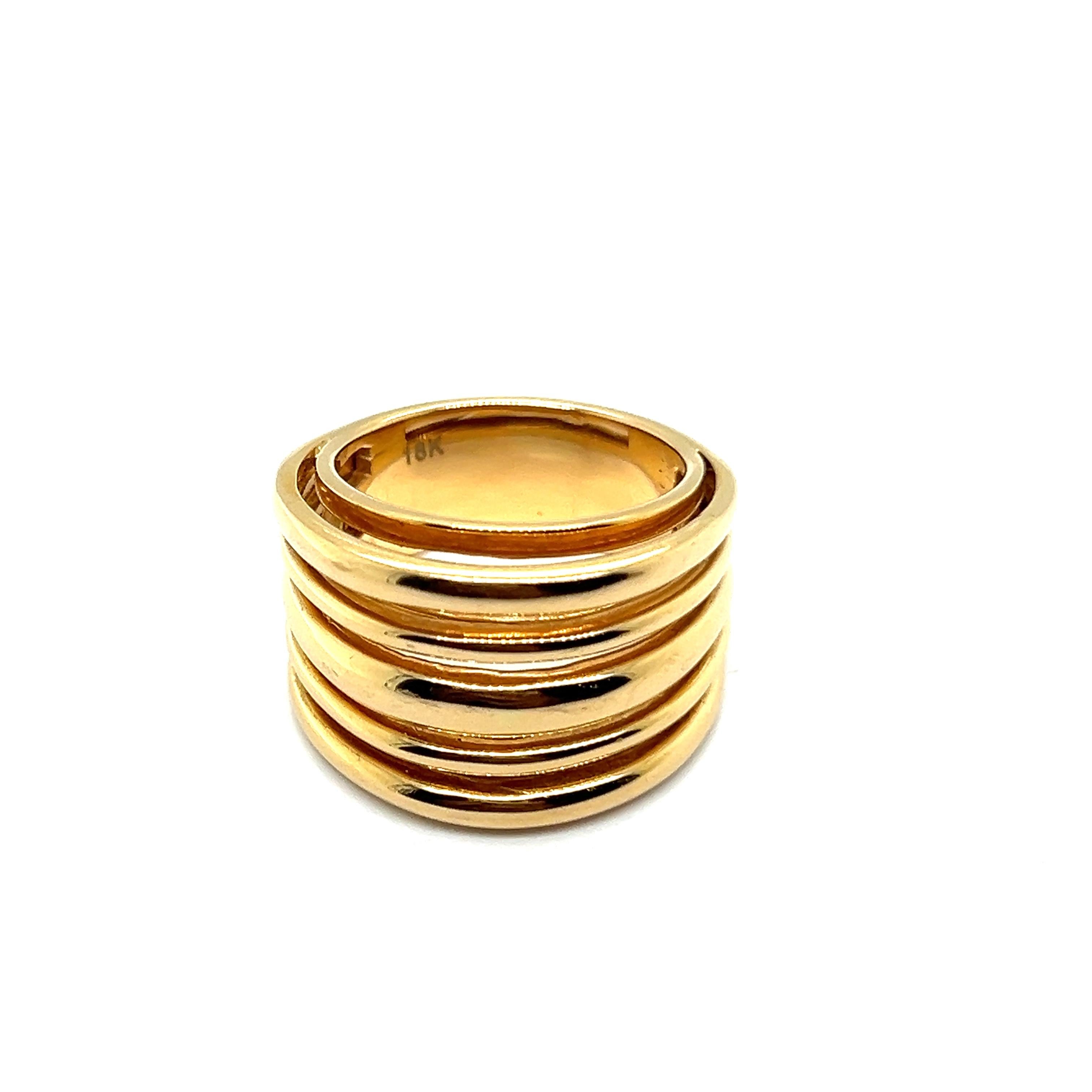 Bold and stylish, this exquisite ring features a wide band composed of multiple interwoven lines, designed to captivate and leave a lasting impression. 

Designed with unparalleled quality in luxurious 18 Karat yellow gold, this ring is a true
