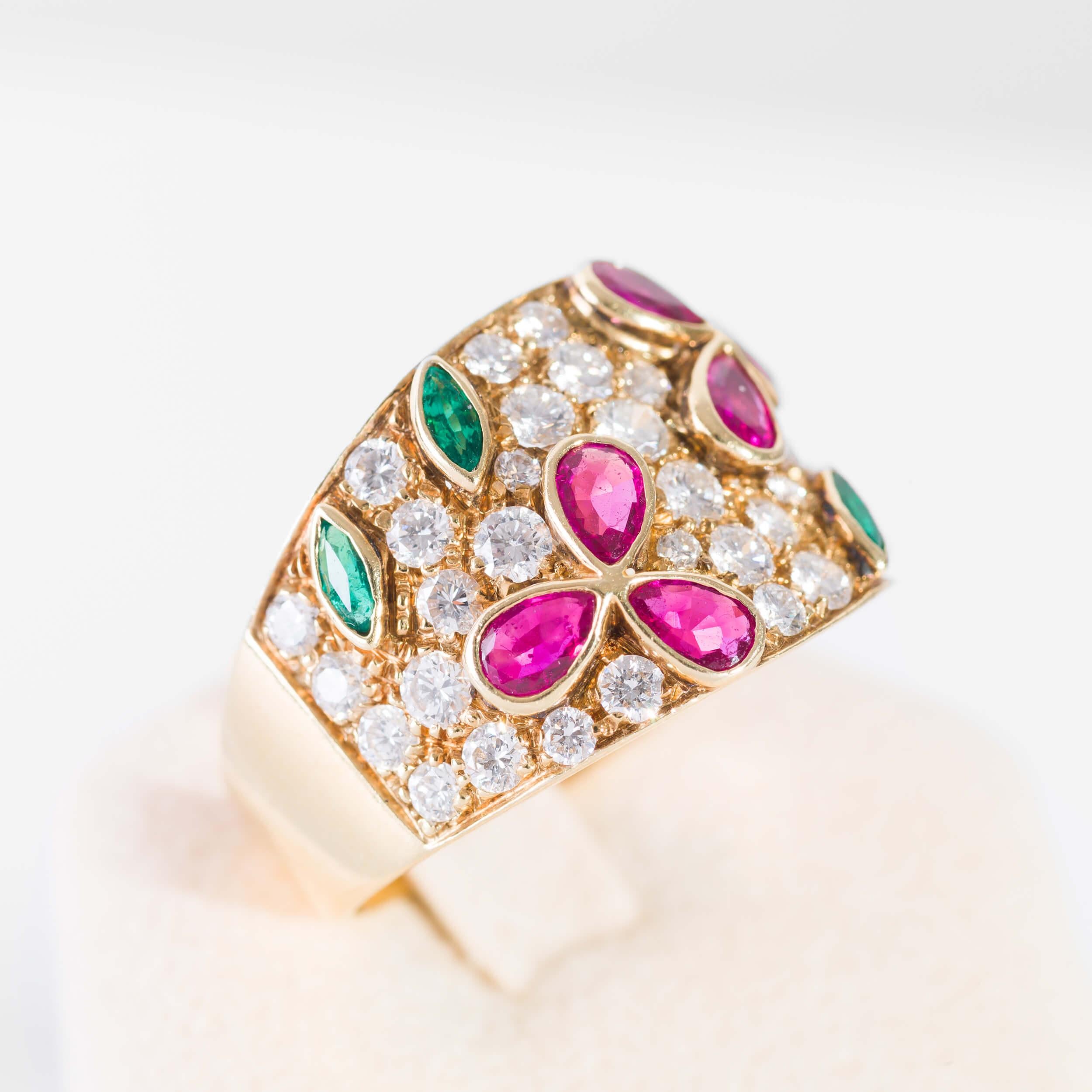 18 kt yellow gold band ring with diamonds and precious stones. Diamonds total 2,15 ct drop cut rubies 0,96 ct and emeralds 0,35 ct 
italian size 19 