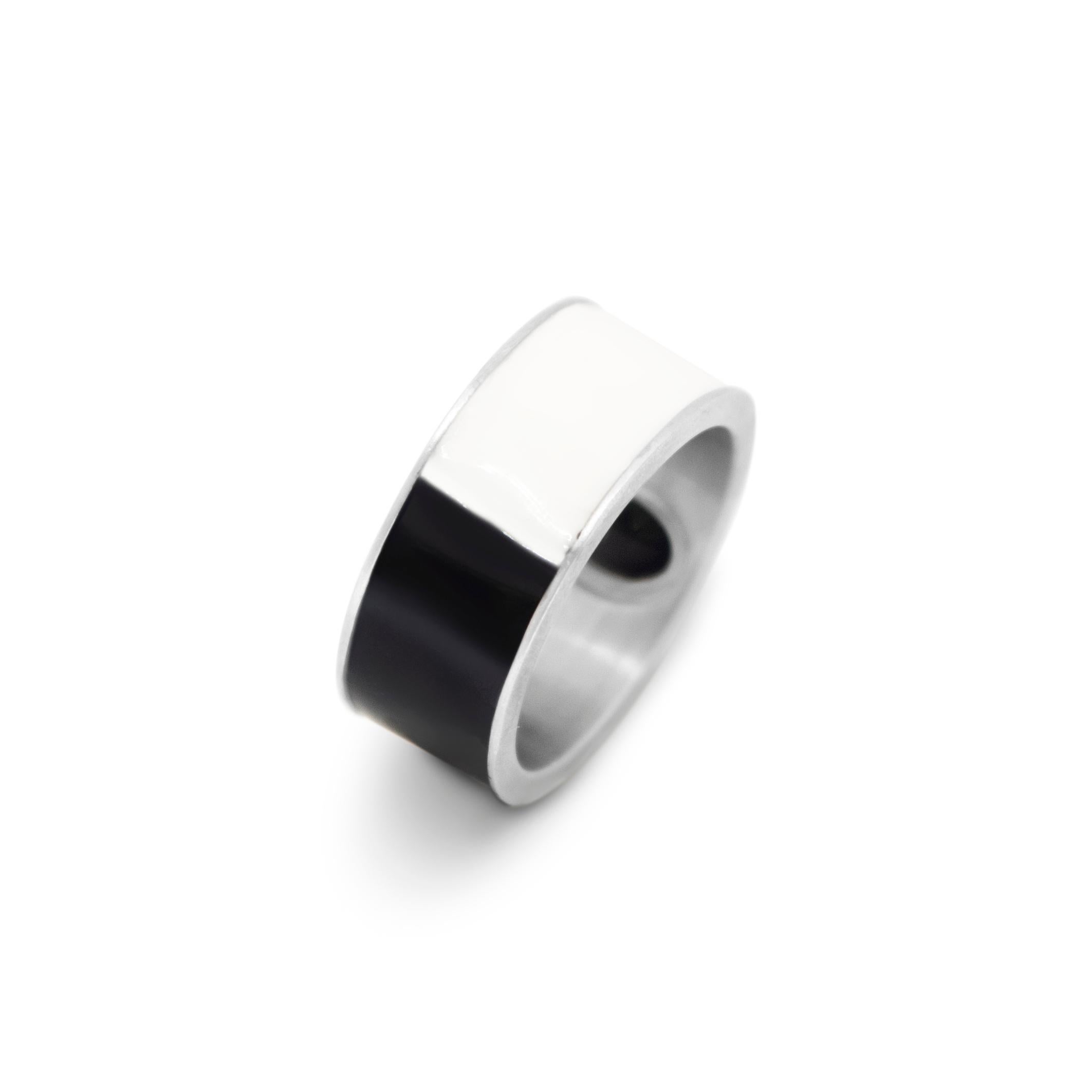 Unisex band ring in satin sterling silver, black and white enamel, set with black onyx cabochon. A geometric, minimalistic, androgynous, piece with healing properties. The black onyx is a powerful stone that releases negativity from a person by