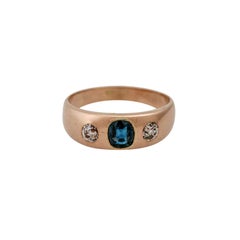 Band Ring with an Oval Faceted Sapphire and 2 Old European Cut Diamonds, Total a