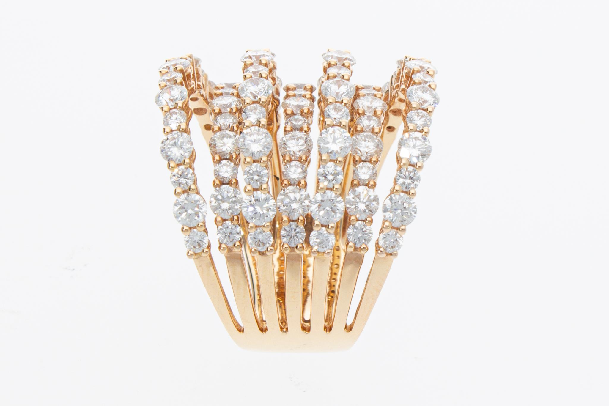 Band model ring in rose gold with seven rows of diamonds. On the seven rows there are eighty-five diamonds set for a total weight of ct 4.20.

Total Carat: ct 4.20
Total Weight: 14,5 grams
Number of Diamonds: N° 85
Ring Size: IT 14; USA 6,75; FR