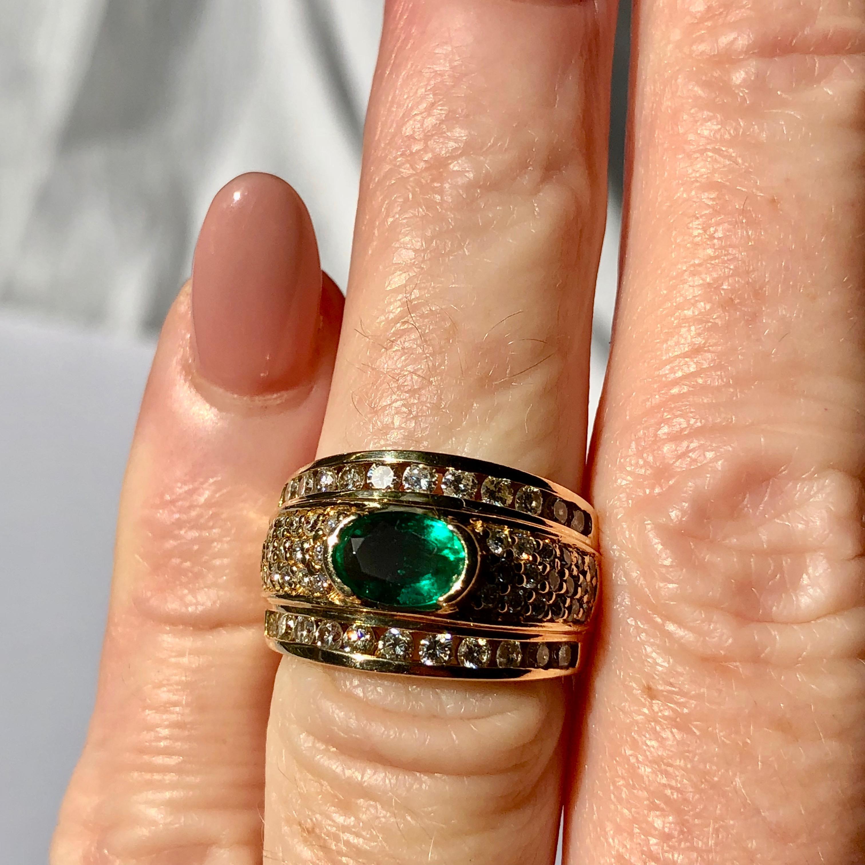 An estimated 1.10ct Oval Emerald surrounded by and estimated 1.50ct of Mele set Diamonds 

This exquisite band ring in an unusual and yet classic design

Size L1/2 We can size to your requirements 

Called the “Stone of Successful Love,” Emerald