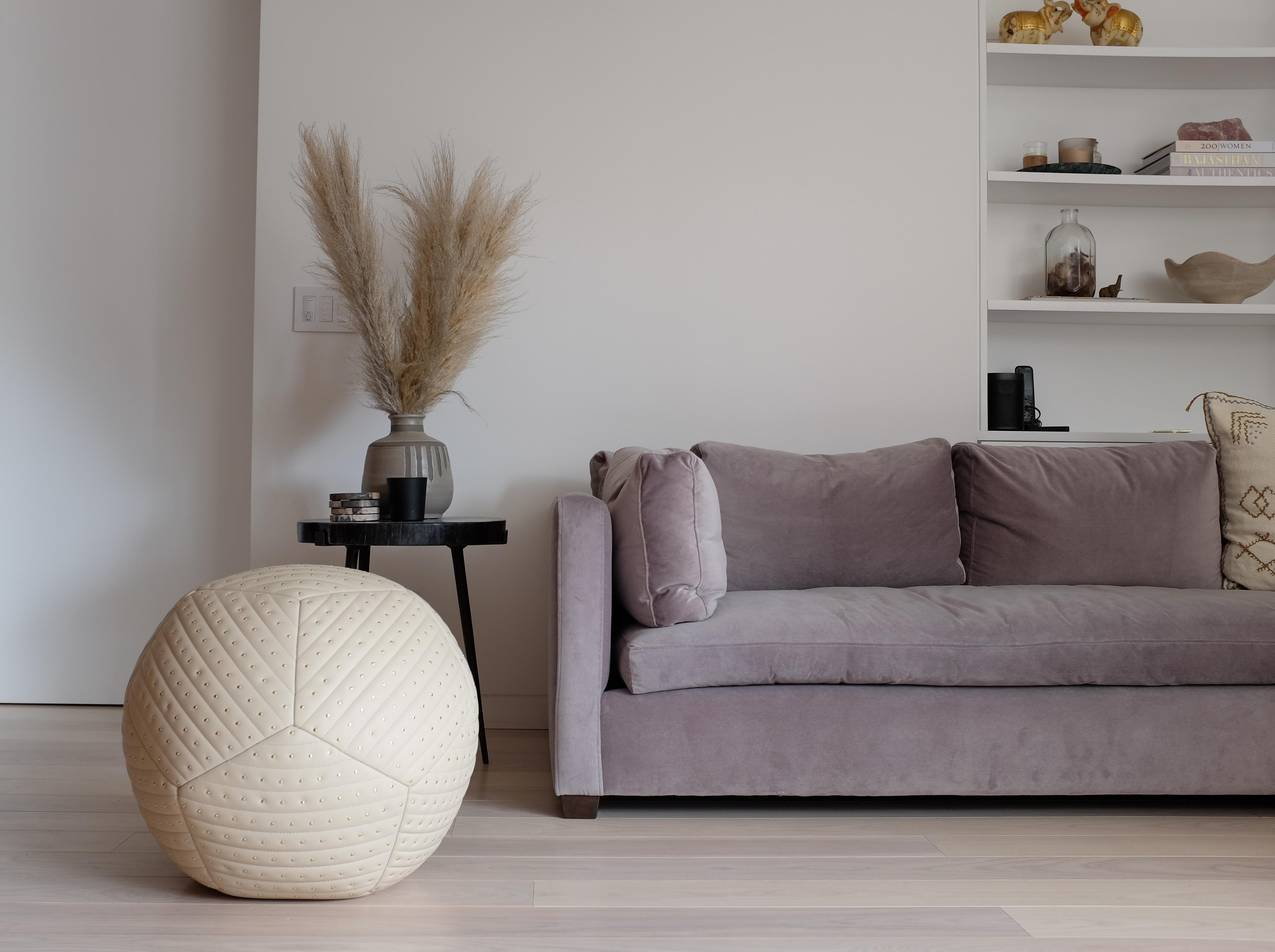 Featured with banded and studded detailing, the Banded Stud Ottoman is inspired by fundamental geometry. These structured and supportive round ball ottomans are designed to function as a traditional leg rest, add a twist to secondary living room