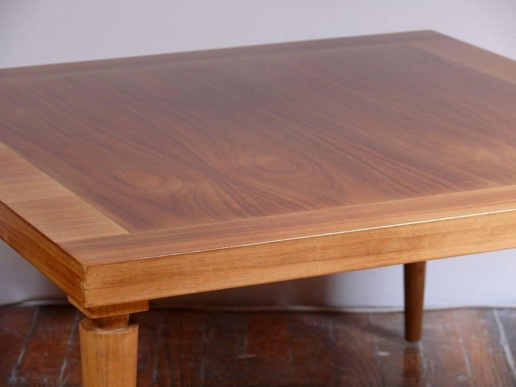 Cocktail table by T.H. Robsjohn-Gibbings for Widdicomb. Signed and labeled. Finished in a natural walnut with banded edge and neoclassic legs.