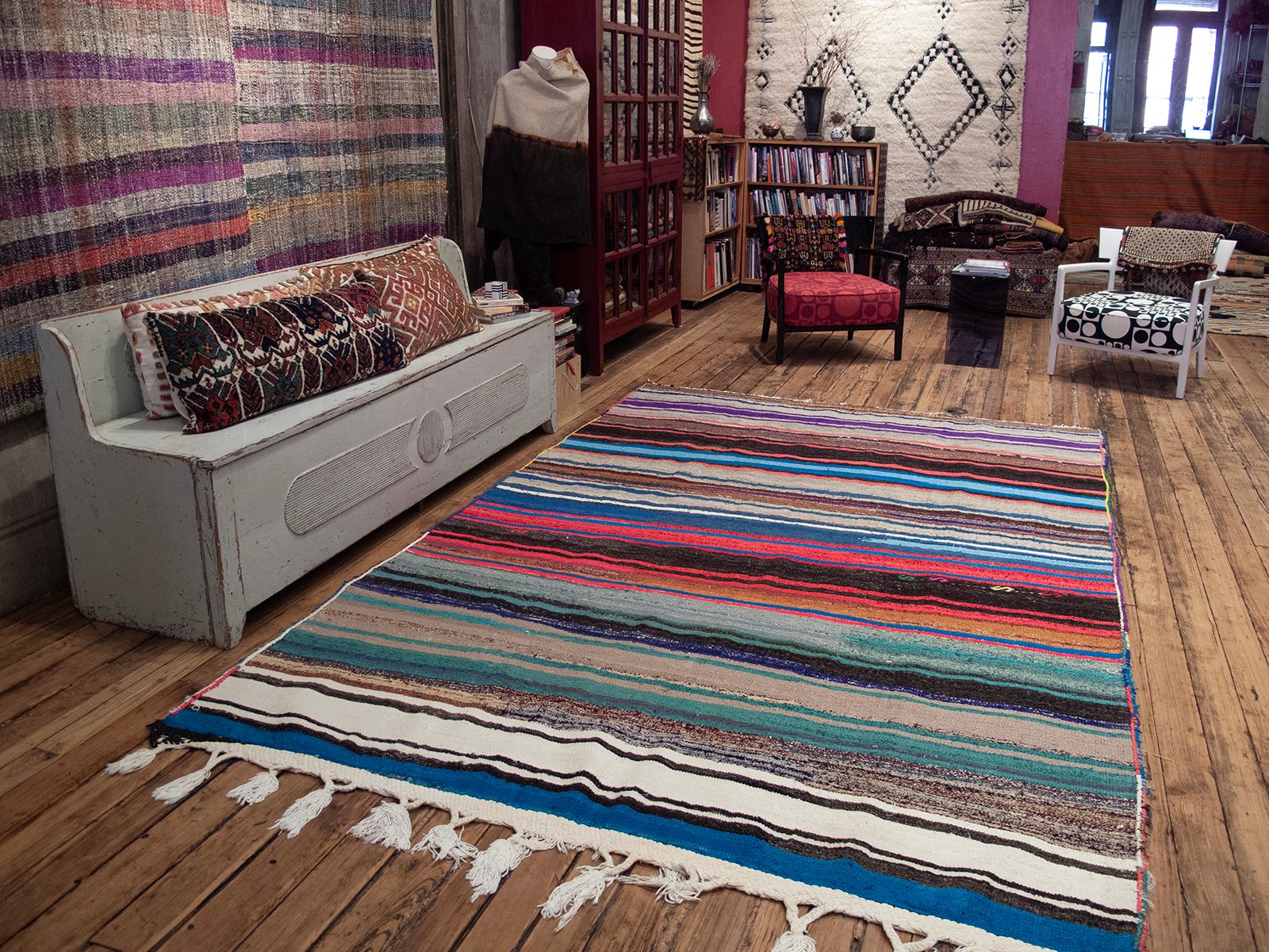 A brightly colored tribal kilim (flat-weave), woven with a mixture of wool, goat hair and cotton.