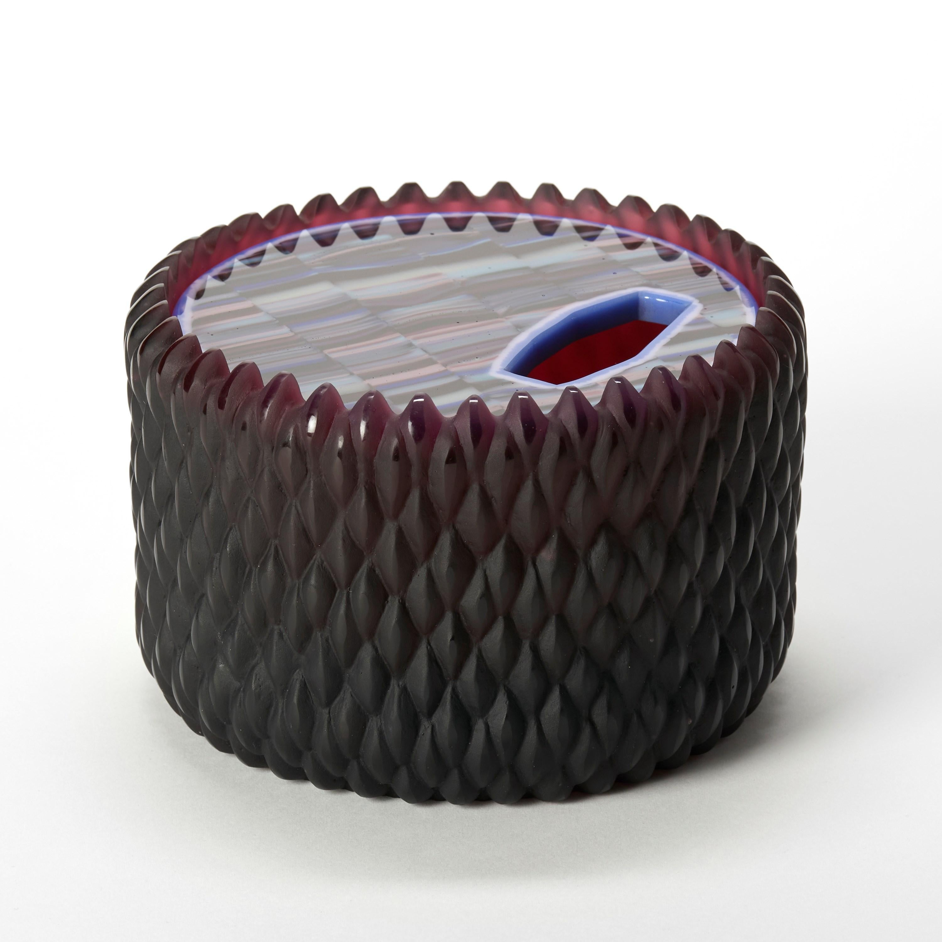 'Banded Lupin' is a unique lost wax cast glass sculptural vessel by the British artist, Angela Jarman.

Jarman is an artist with over 20 years experience in glass. Technical skill and understanding of her material, combined with a strong aesthetic